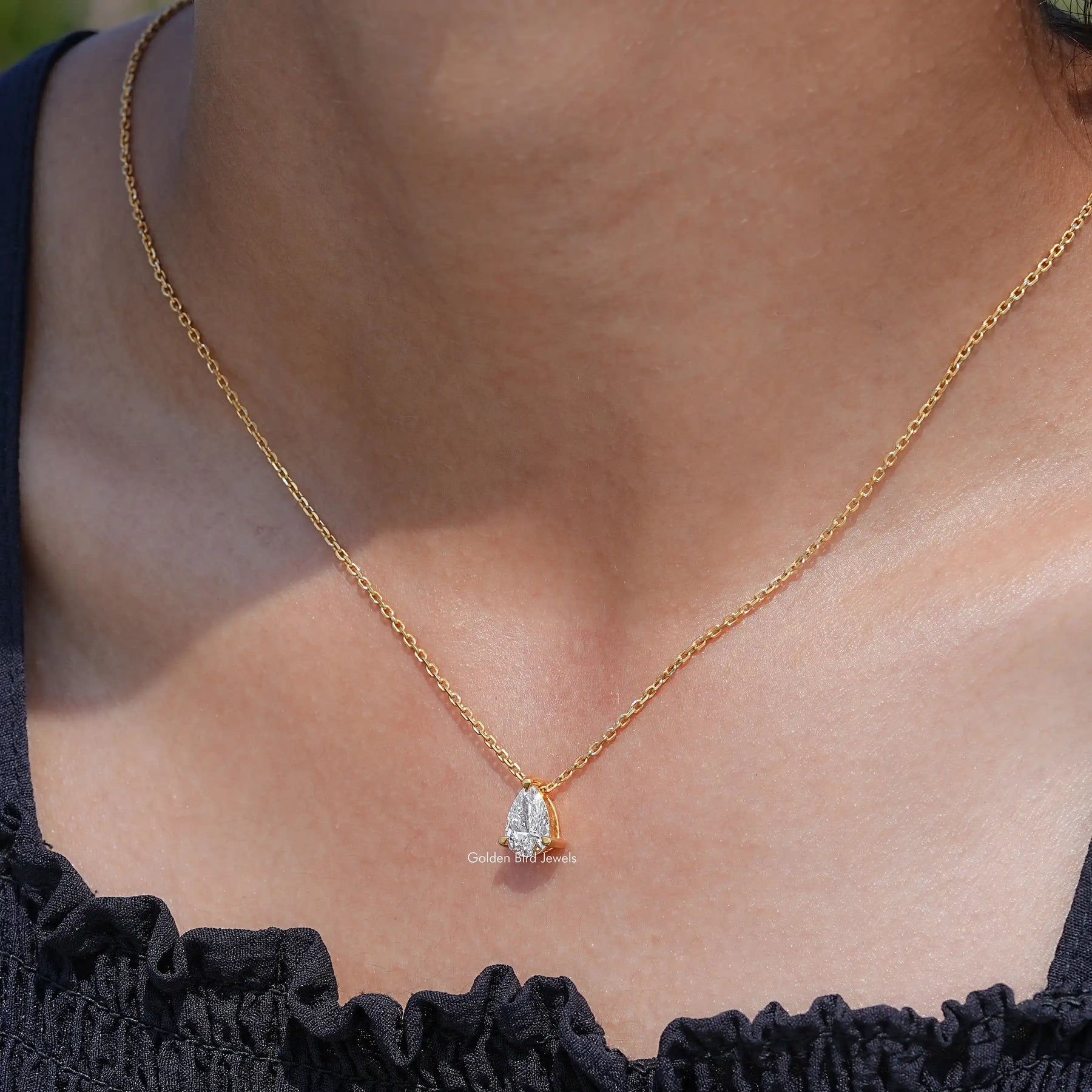 In neck view of Pear cut diamond halo pendant