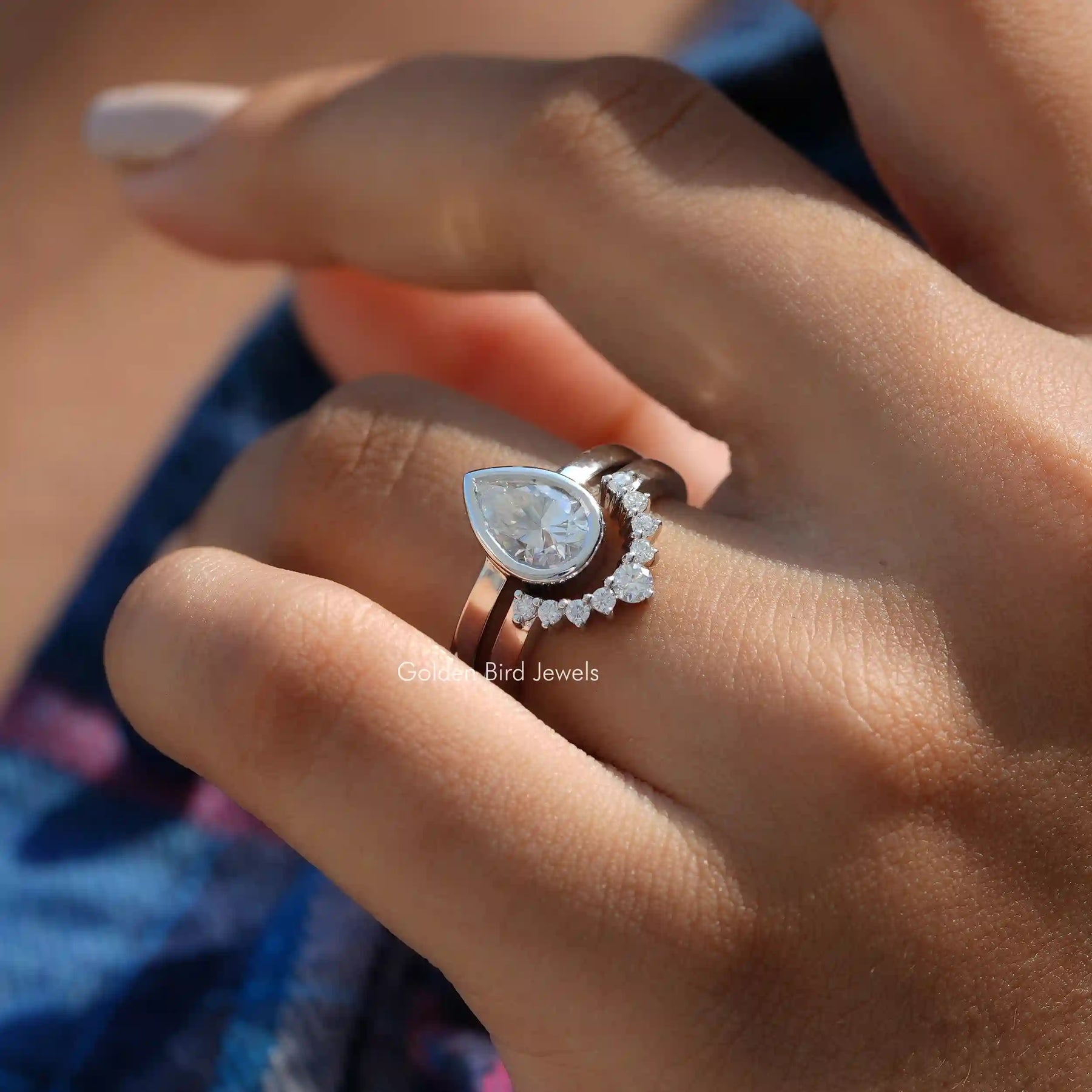 Close-Up View of Pear Cut Moissanite Bridal Ring Set In White Gold