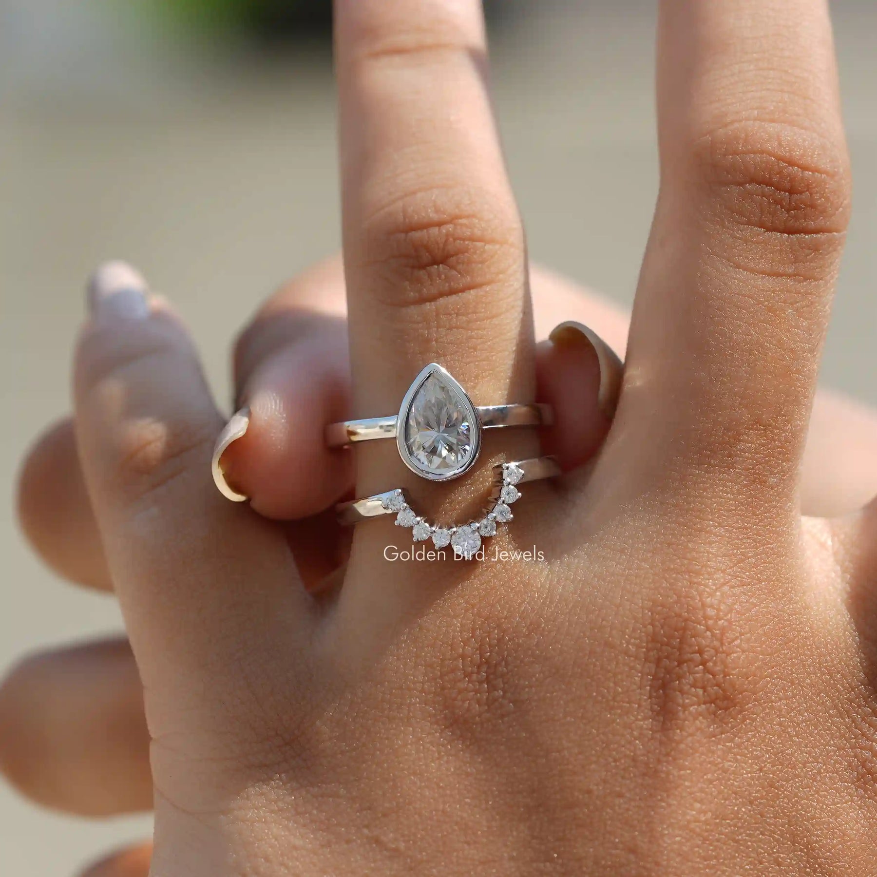 View of Pear Cut Moissanite Bridal Ring Set In Finger