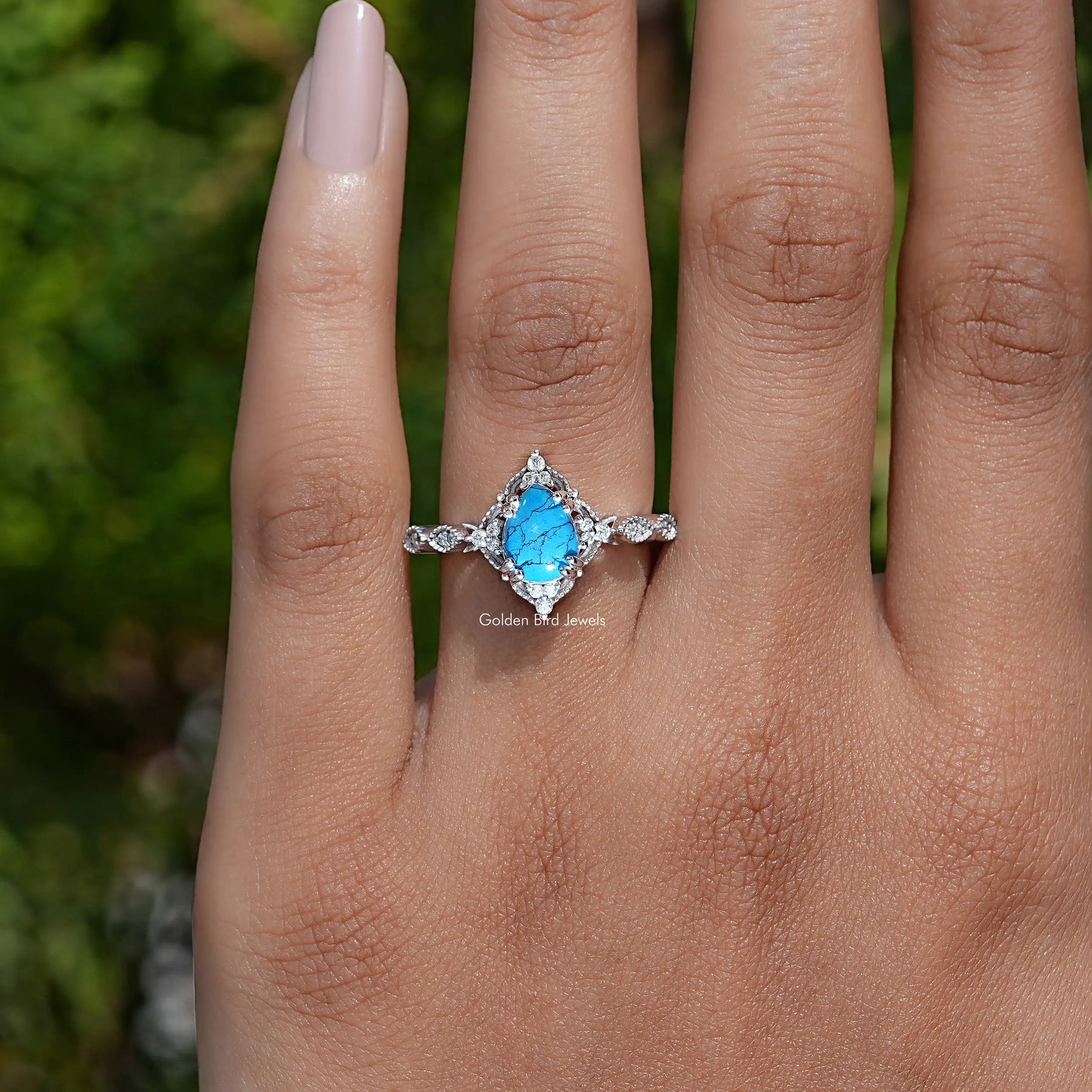 Detailed View of Pear Shape Gemstone Accent Ring In White Gold