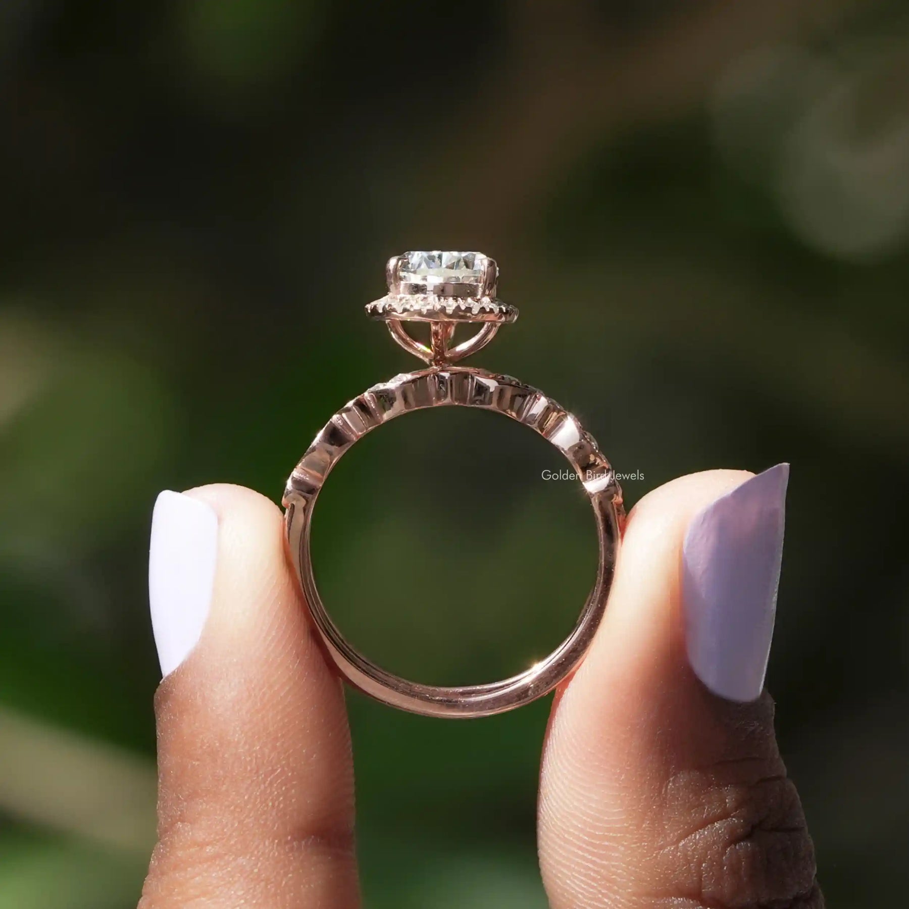 Back View of Pear Cut Moissanite Ring Set In two fingers