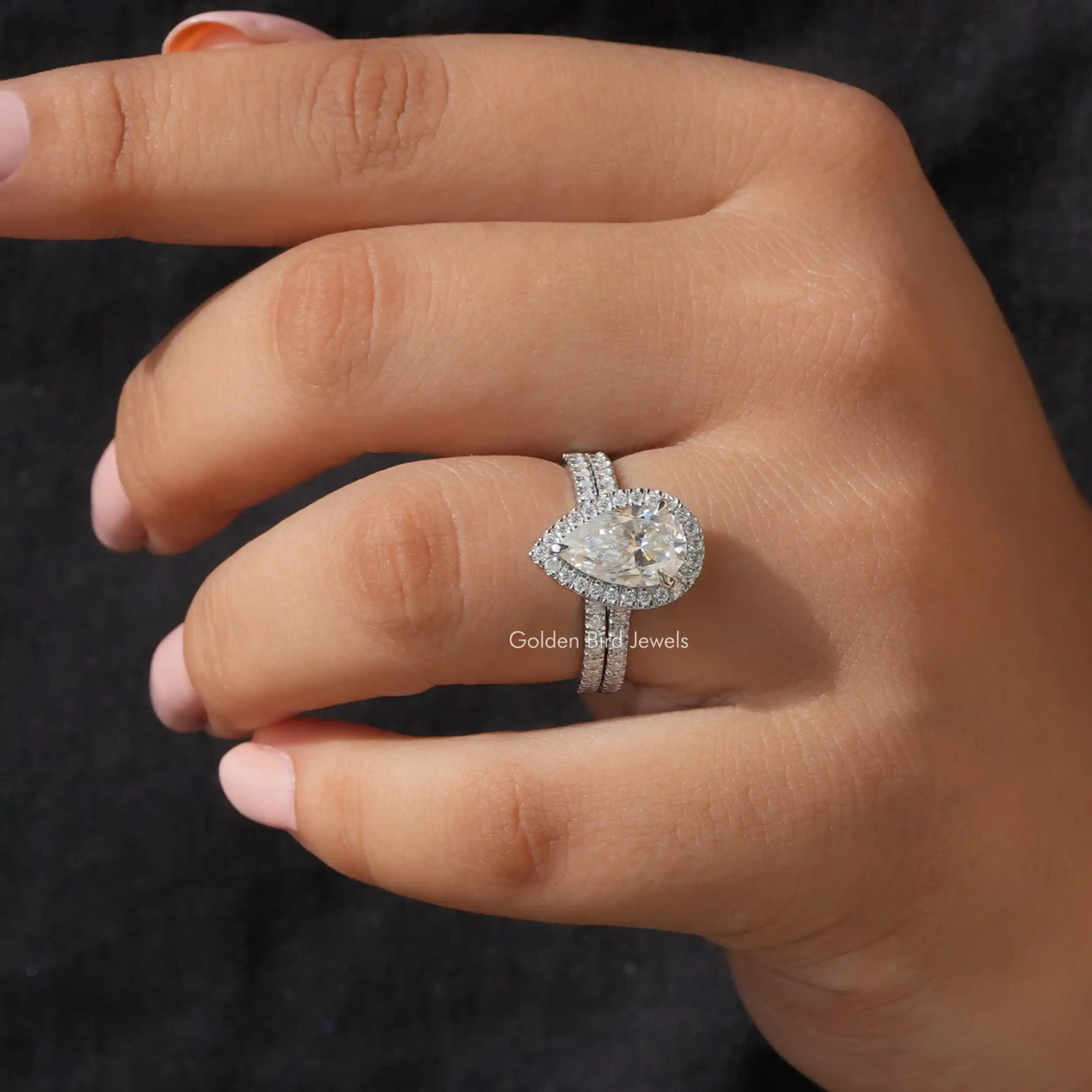 pear shaped halo moissanite ring set crafted in vvs clarity