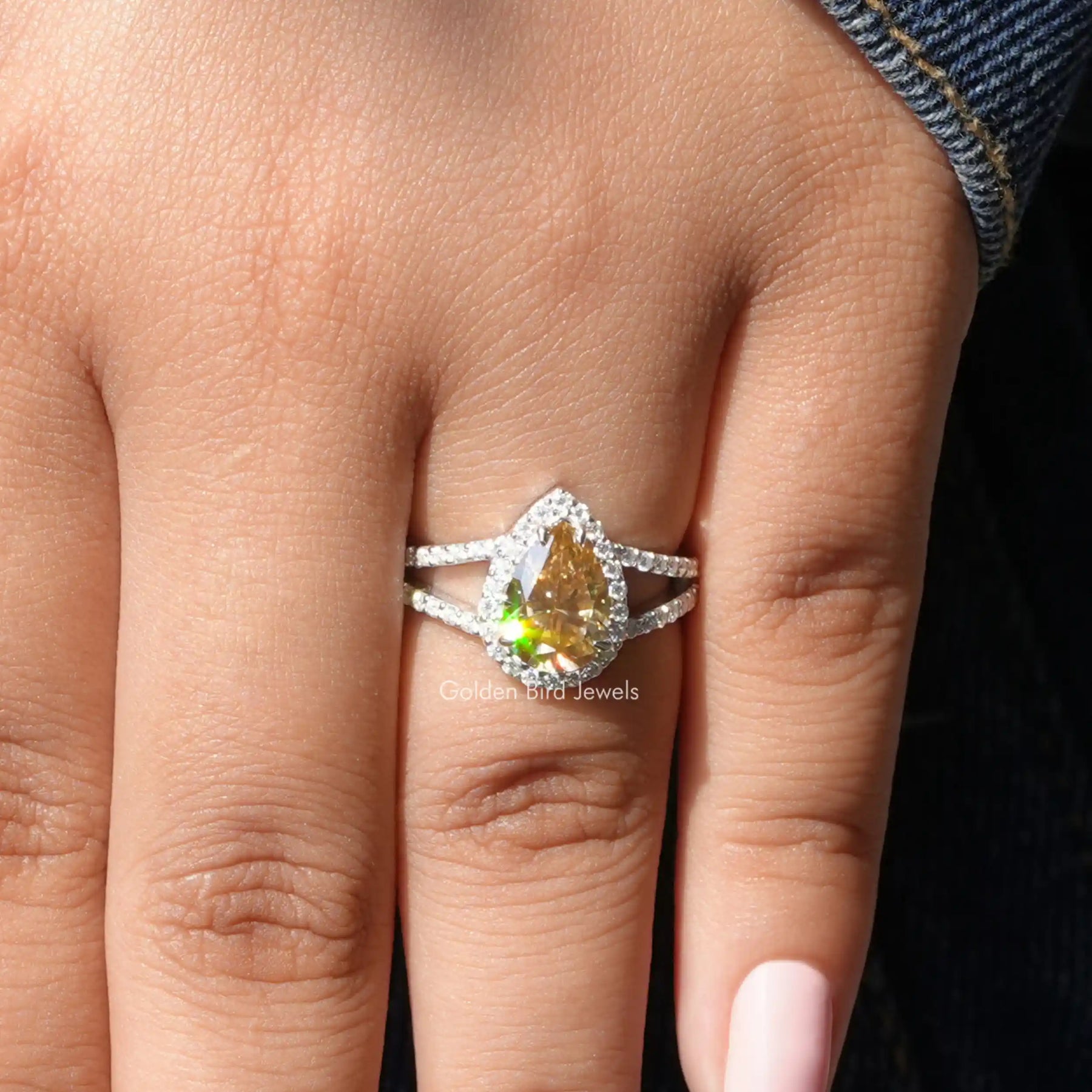 Pear Cut Moissanite Halo Engagement Ring In finger