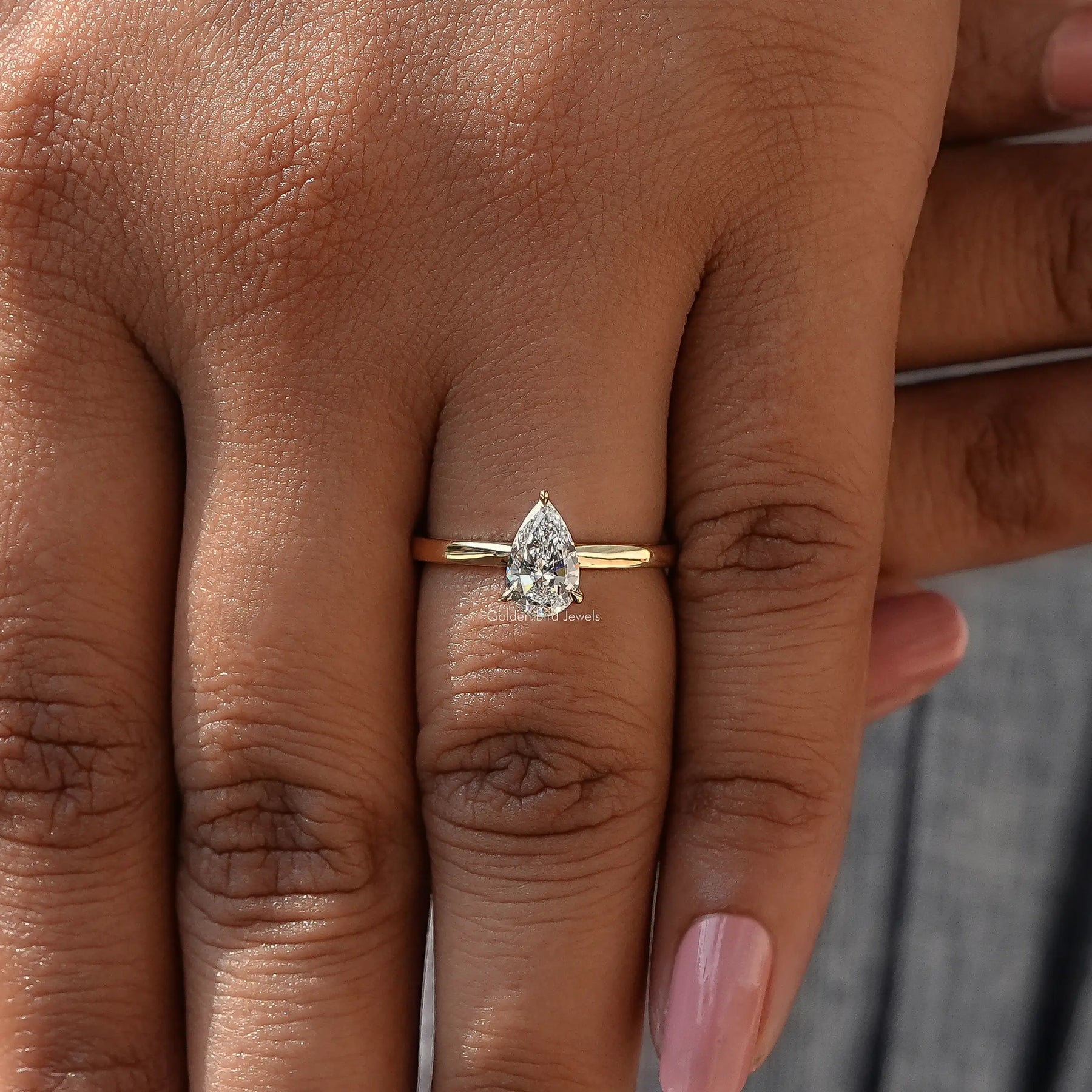 Close-Up View of Pear Cut Diamond Solitaire Ring In Yellow Gold