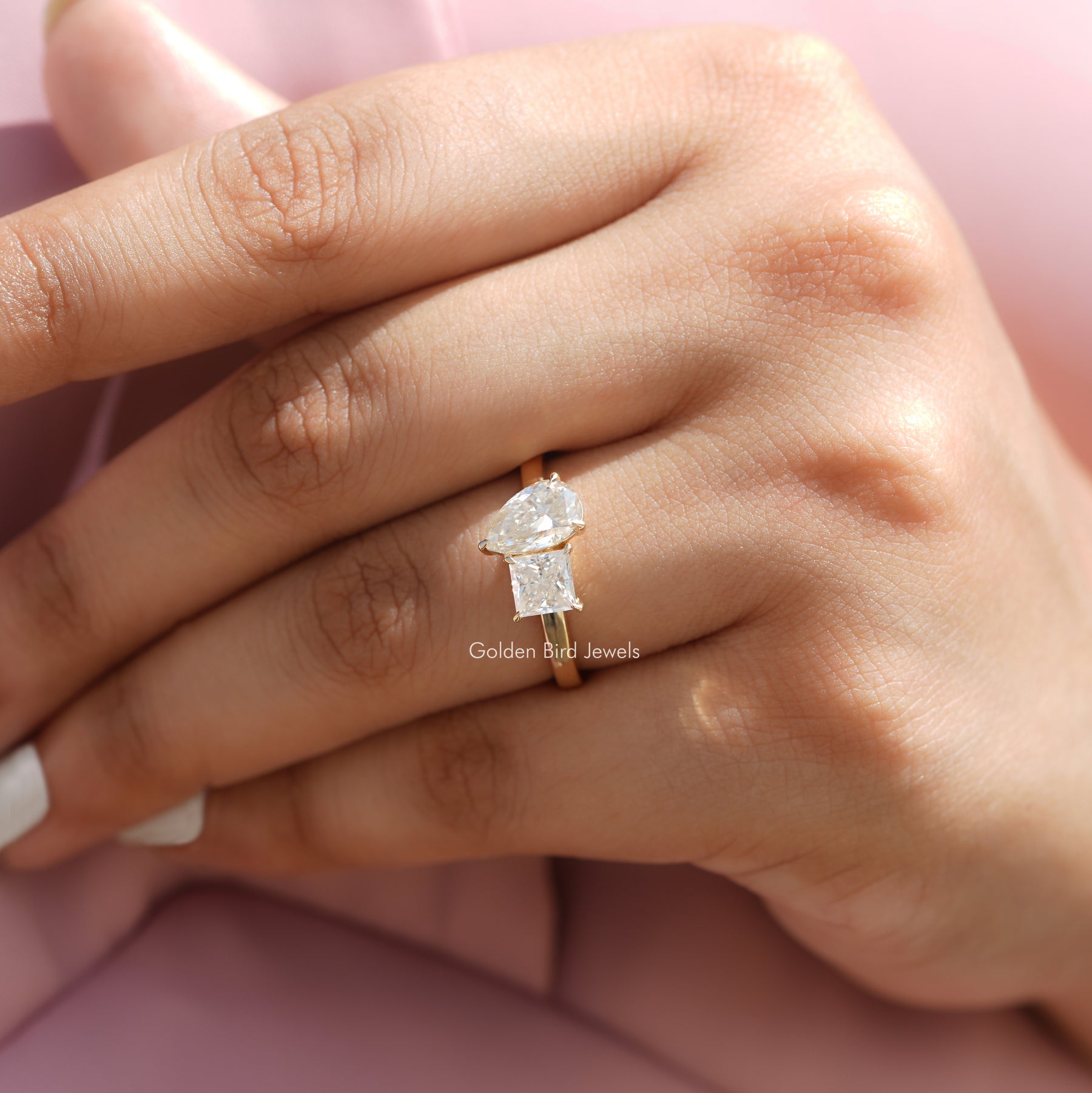 View of Moissanite Toi Et Moi Pear And Princess Cut Ring
