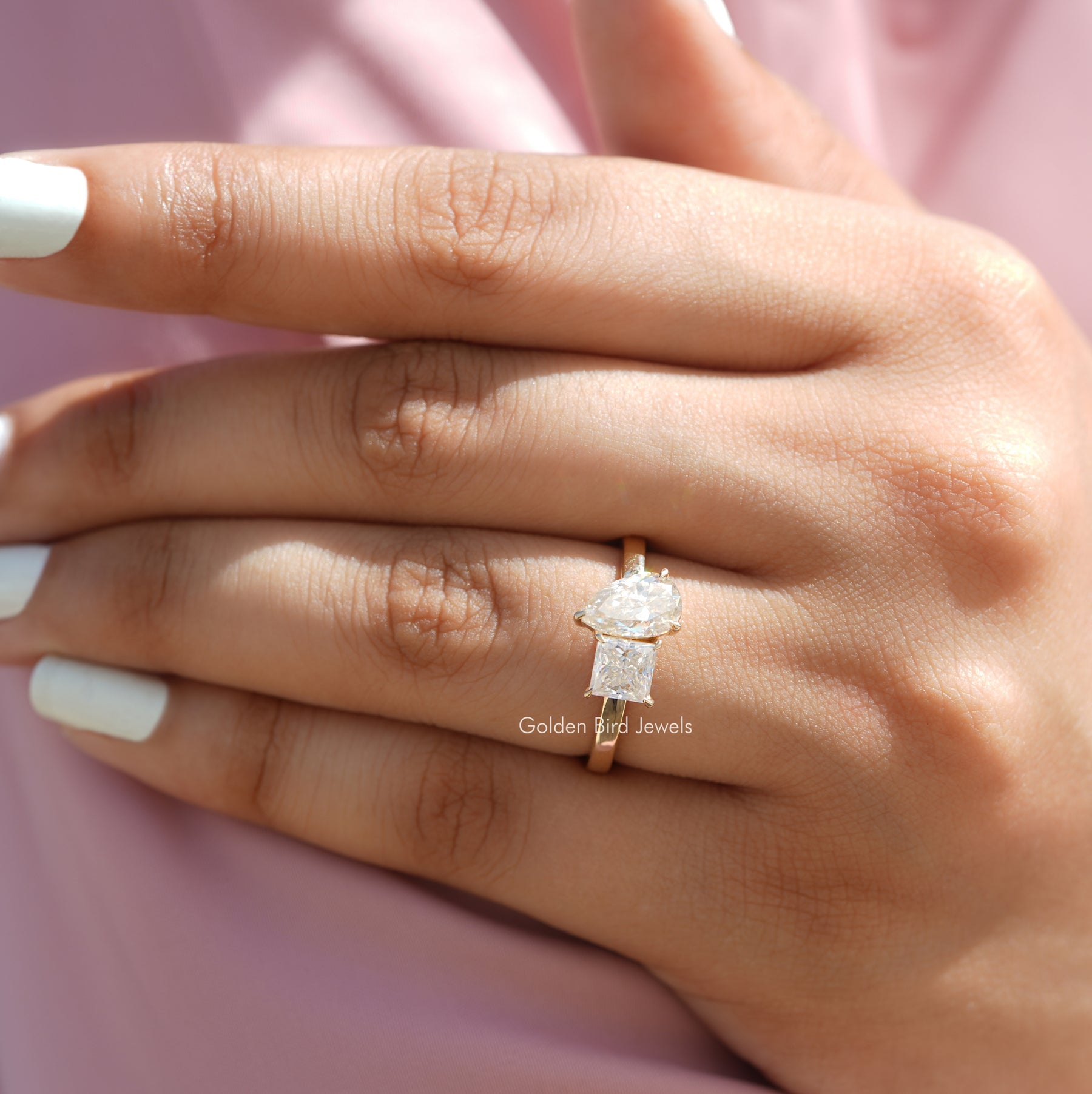 View of Pear And Princess Shaped Moissanite Ring In Yellow Gold