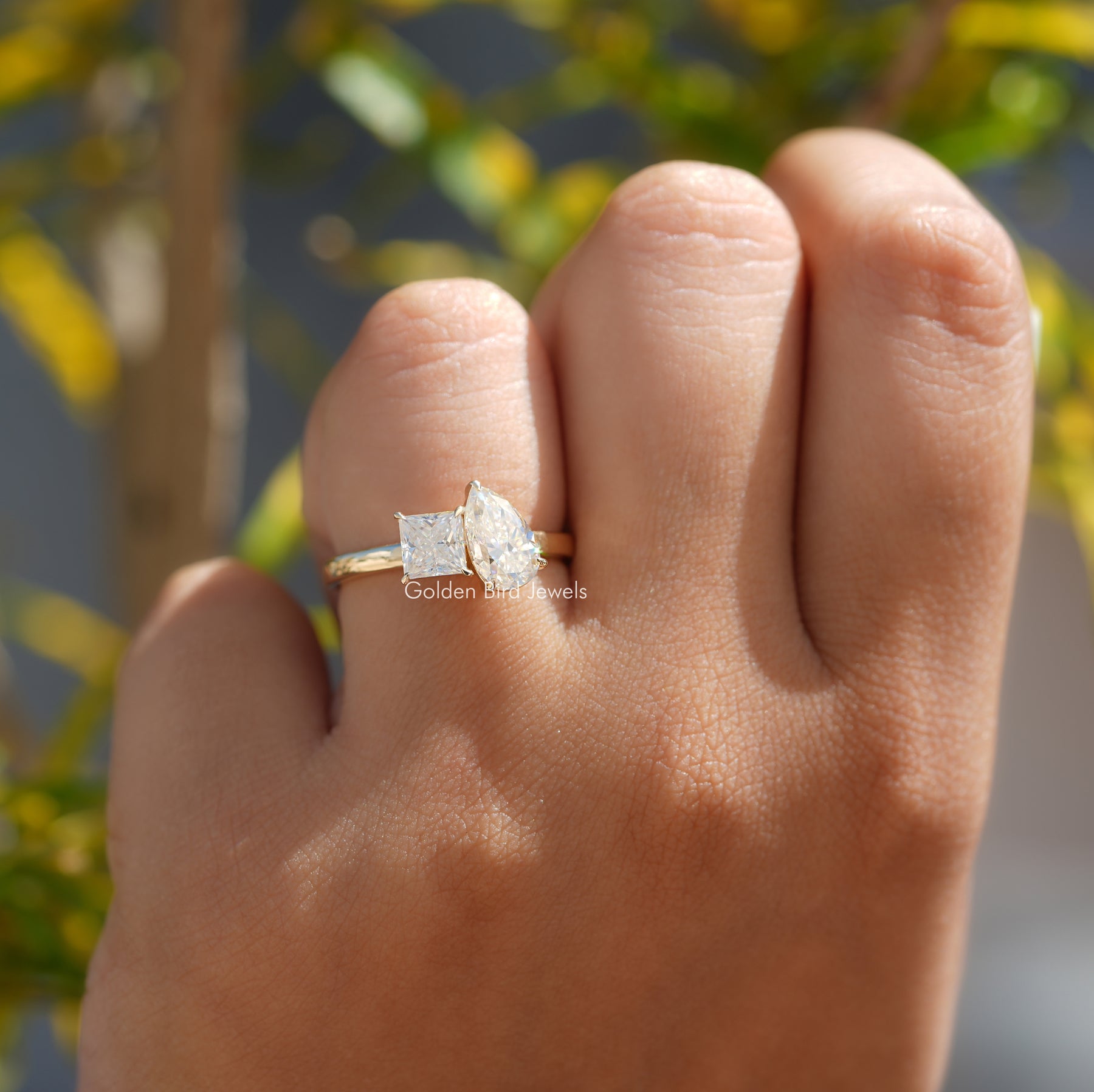 View of Moissanite Pear And Princess Cut Ring In Yellow Gold