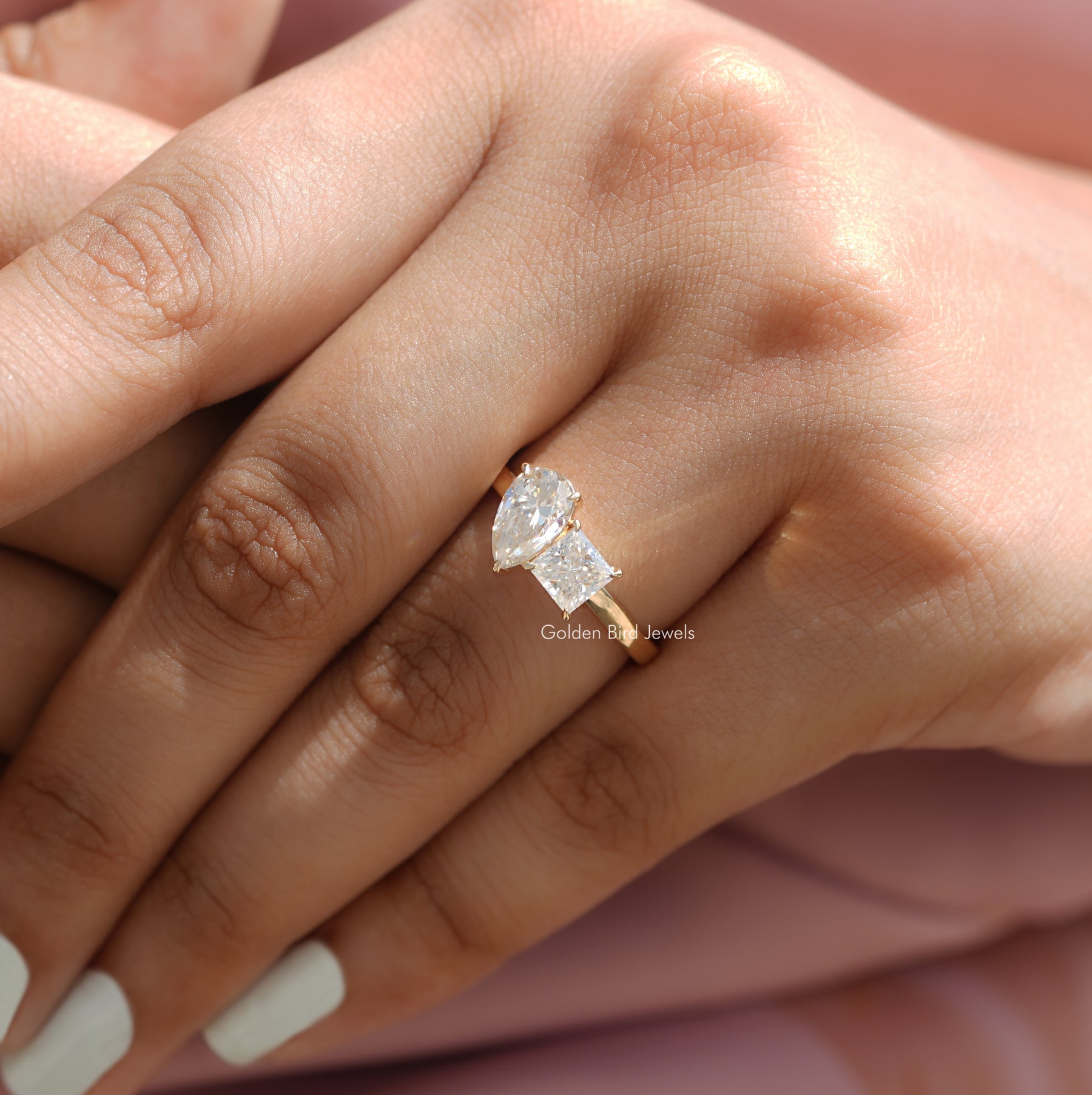 Detailed View Of Pear and Princess Cut Moissanite Toi Et Moi Ring In Yellow Gold