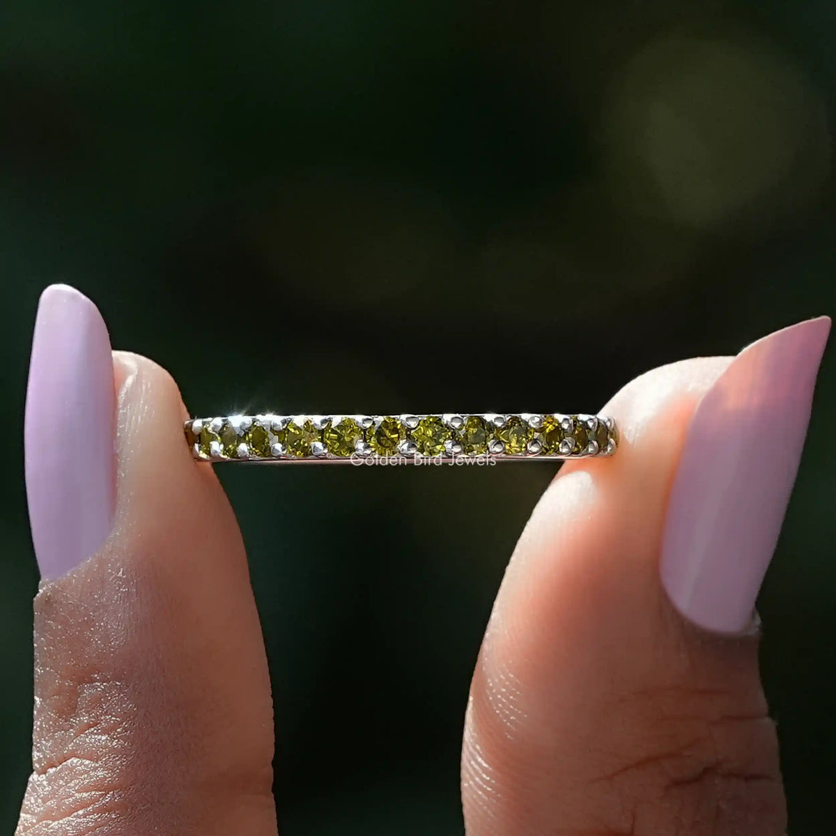 Front view of August Birthstone Peridot Green Round Eternity Band