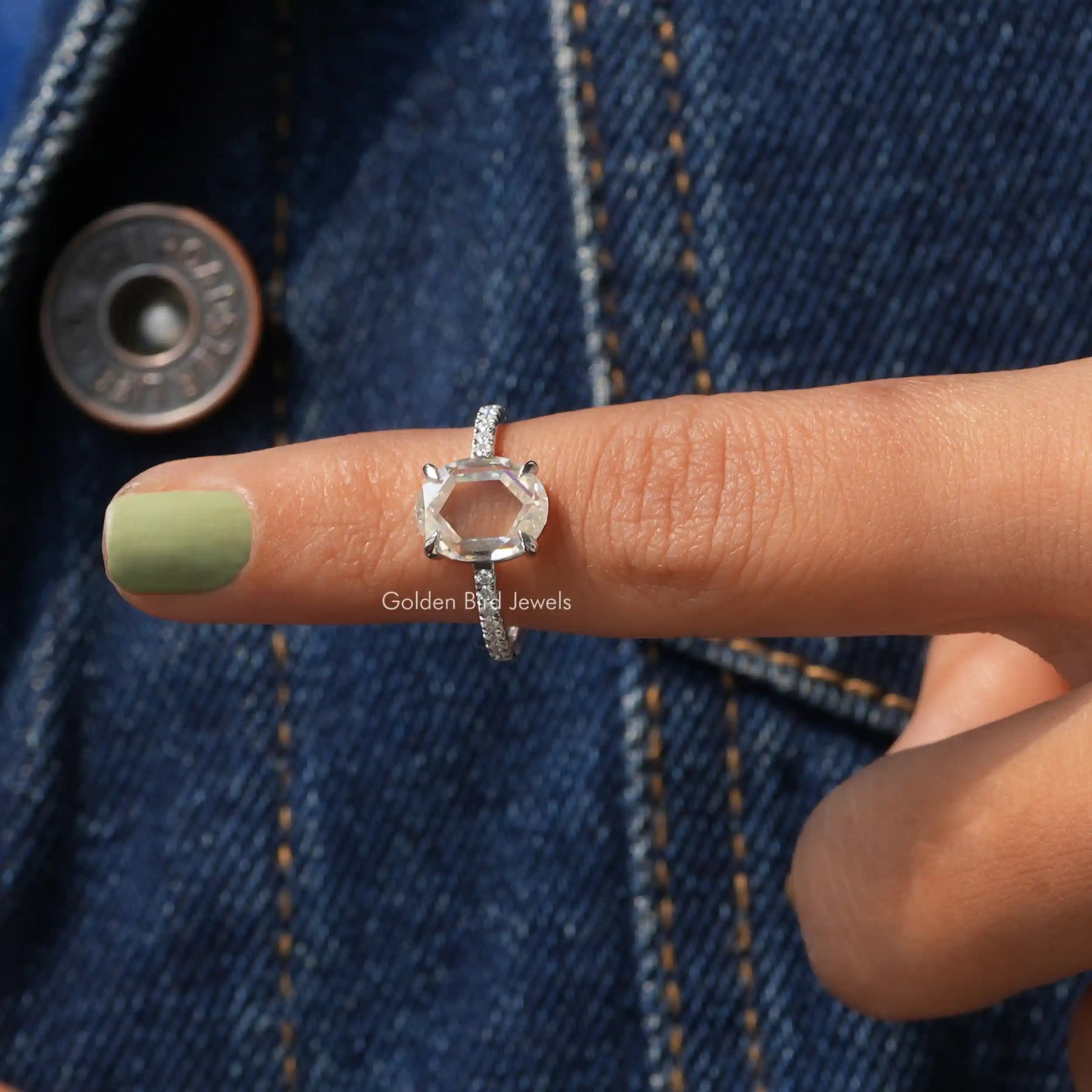 In finger front View of Portrait Cut Oval Moissanite Ring In White Gold