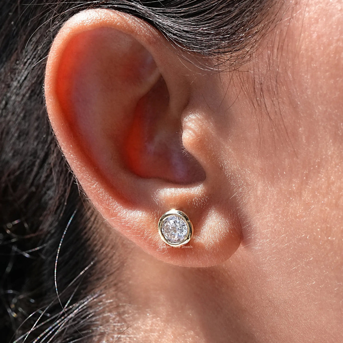 Close view of Moissanite stud earrings in Portuguese