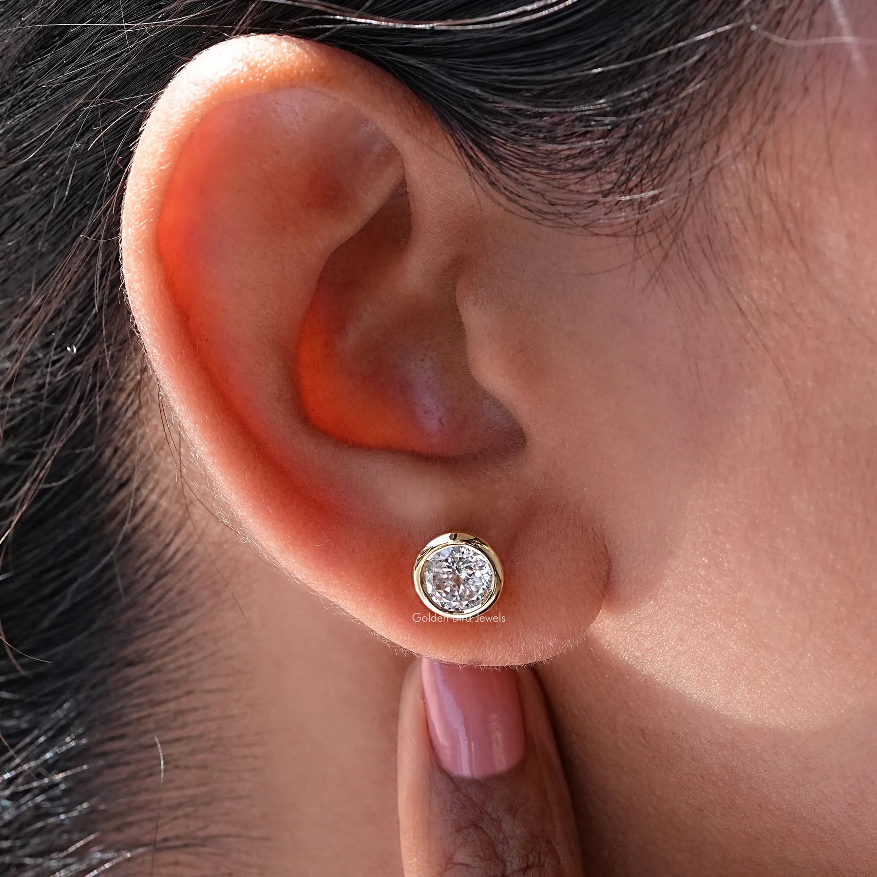 Detailed view of moissanite earrings in secure setting