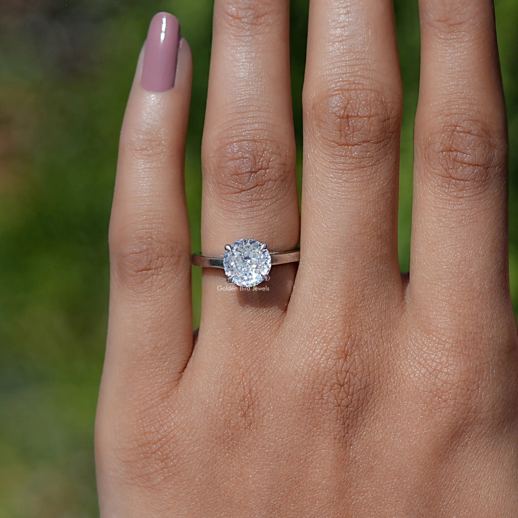 In finger view of Portuguese Cut Moissanite Solitaire Ring