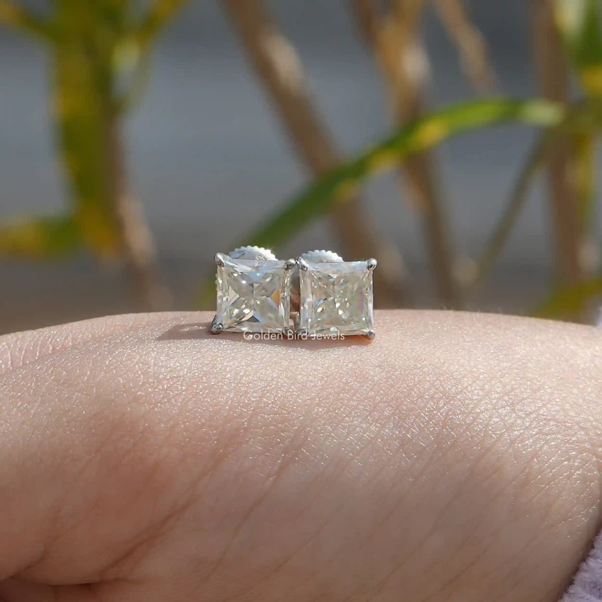Front view of princess cut stud earrings