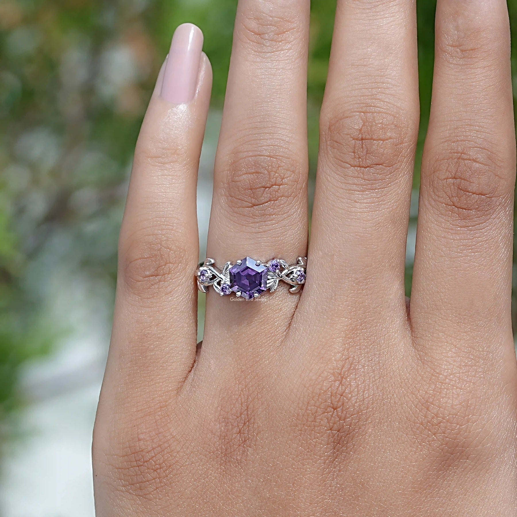 In finger front View of Round Cut Engagement Ring In White Gold