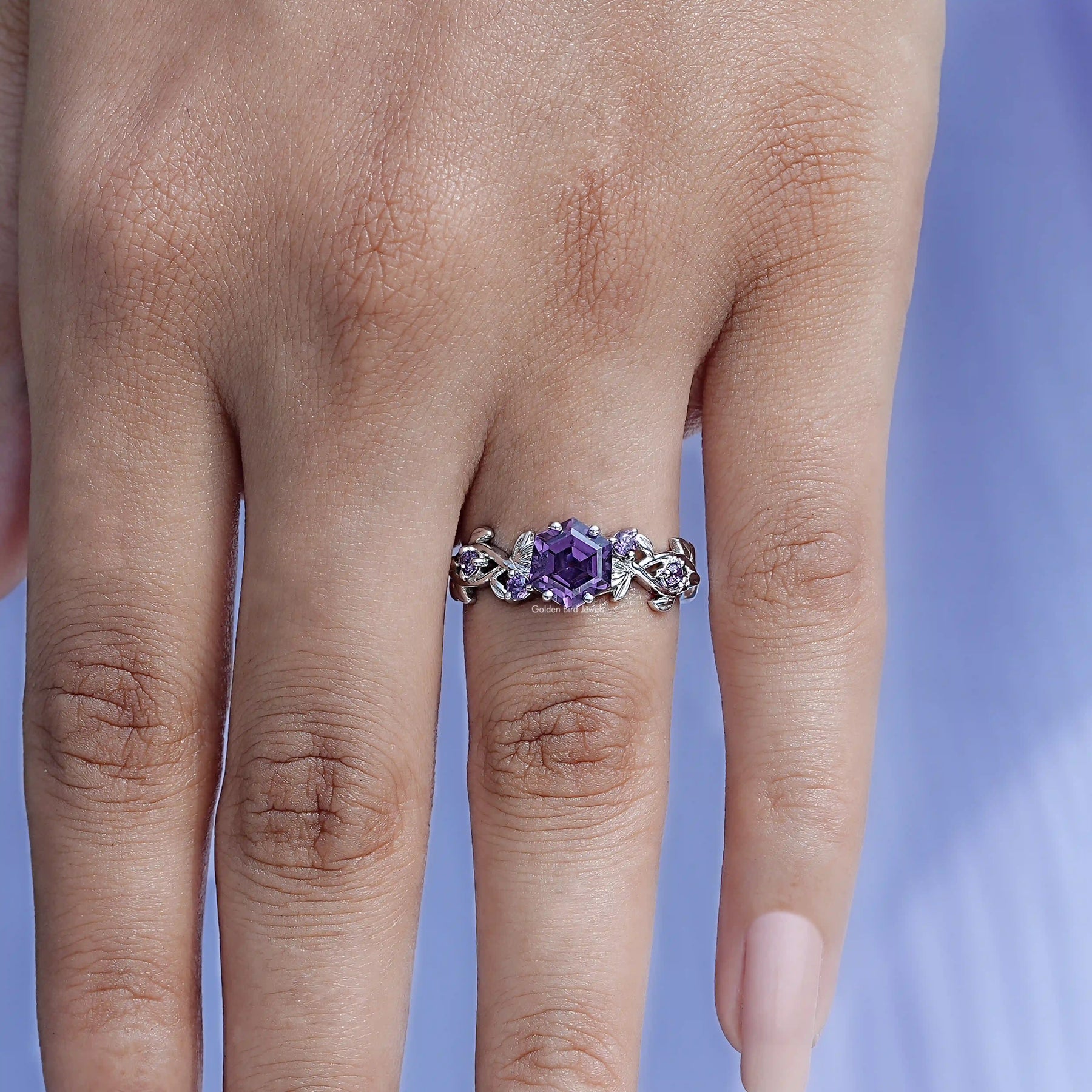 Close-Up View of Leaf Engagement Ring In Hexagon Cut In White Gold