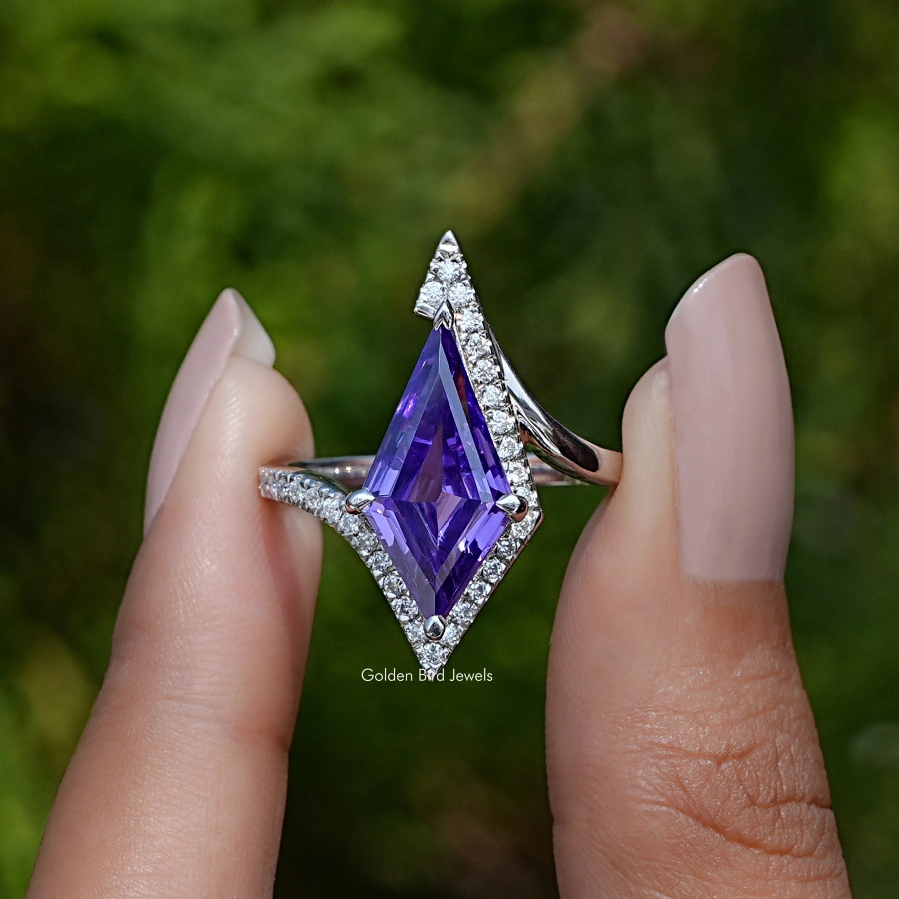 Front View of Amethyst Kite Cut Gemstone Halo Accent Ring In two Fingers