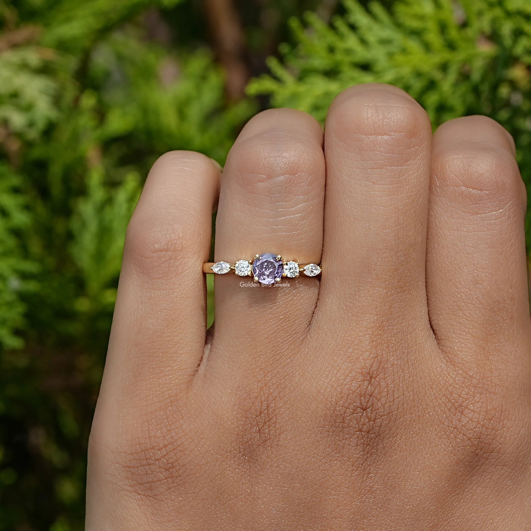Close-Up View of Purple Amethyst Round Cut Gemstone Ring In Yellow Gold