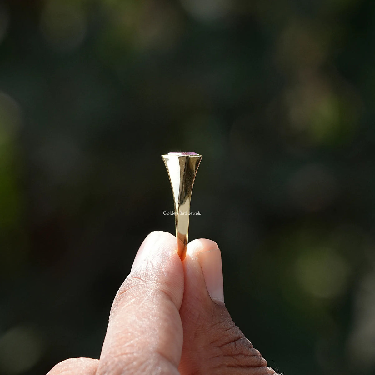 Side view of Asscher cut Ring in yellow gold