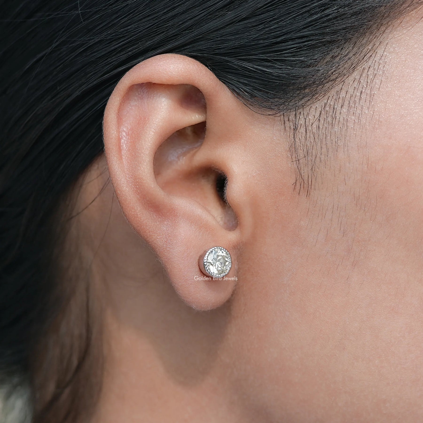 Detailed view of Old European Round Stud Earrings in secure setting