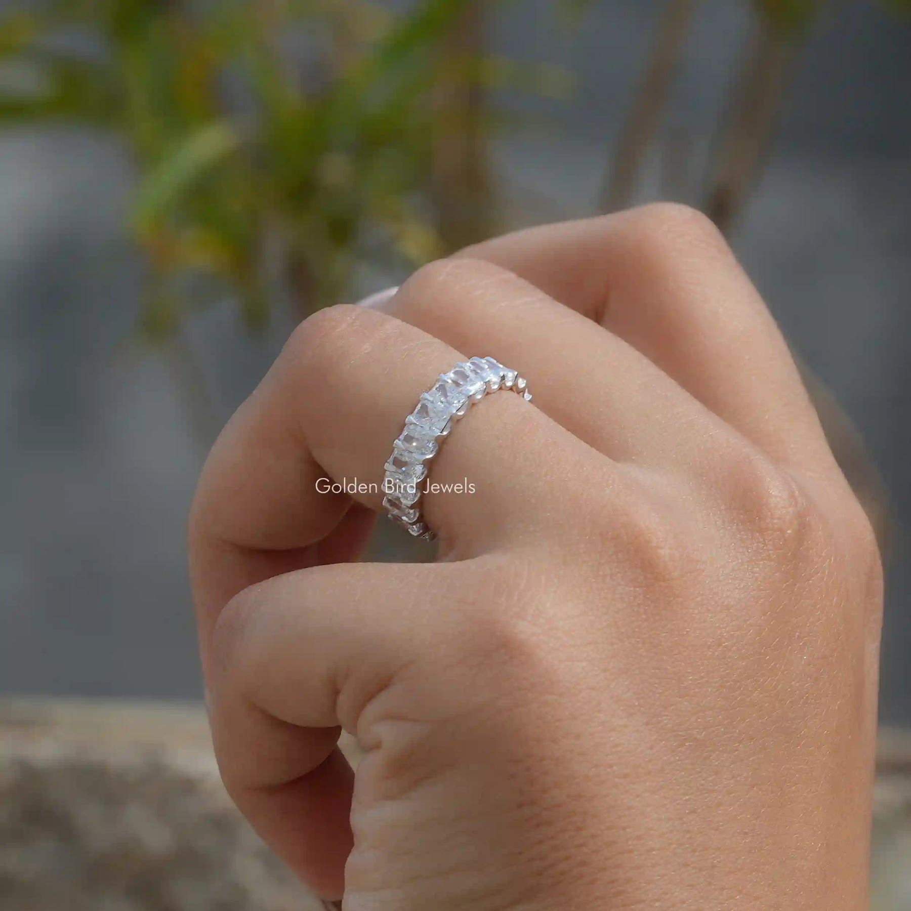 View of Radiant cut diamond anniversary band crafted with prongs set