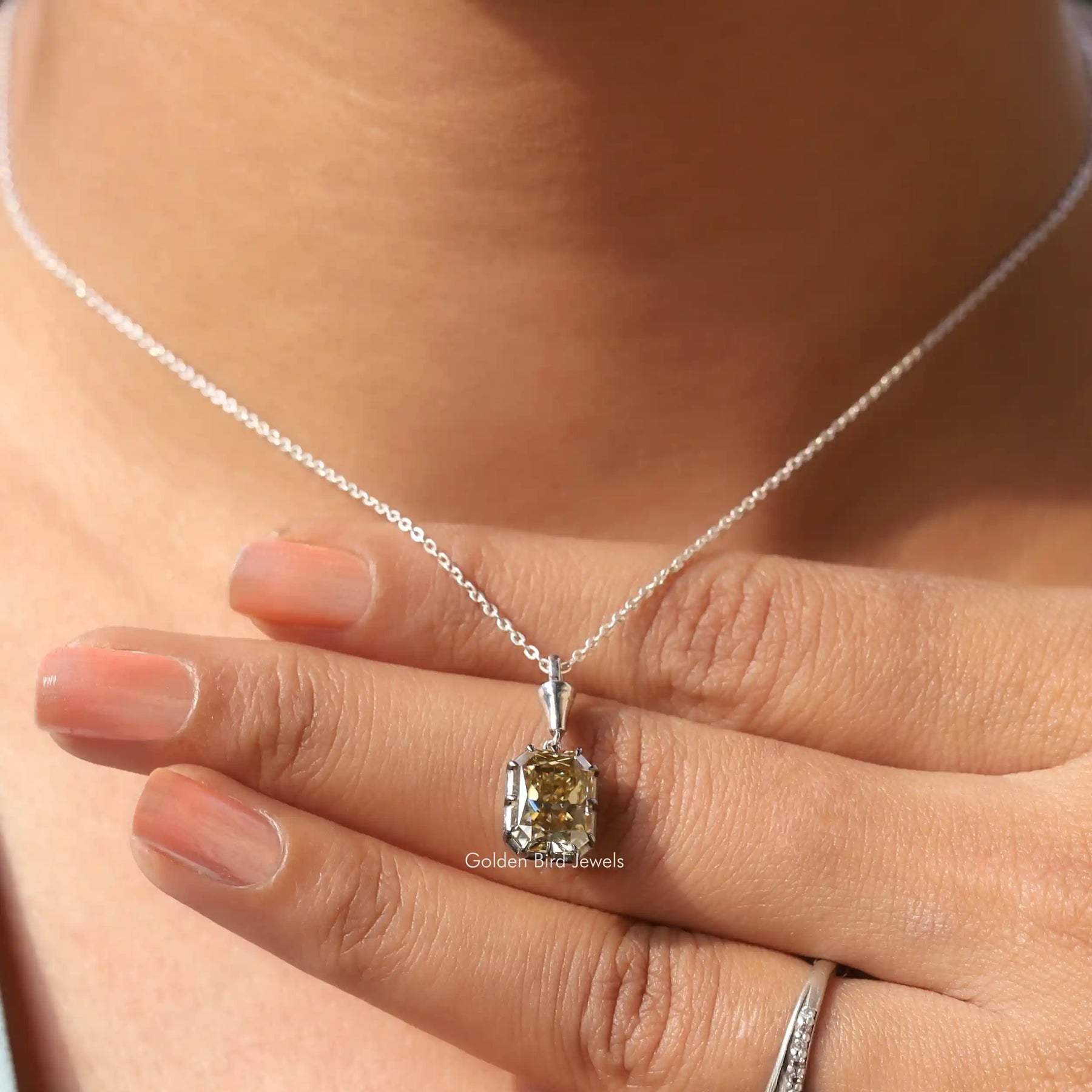 Full view of moissanite pendant in unique shape