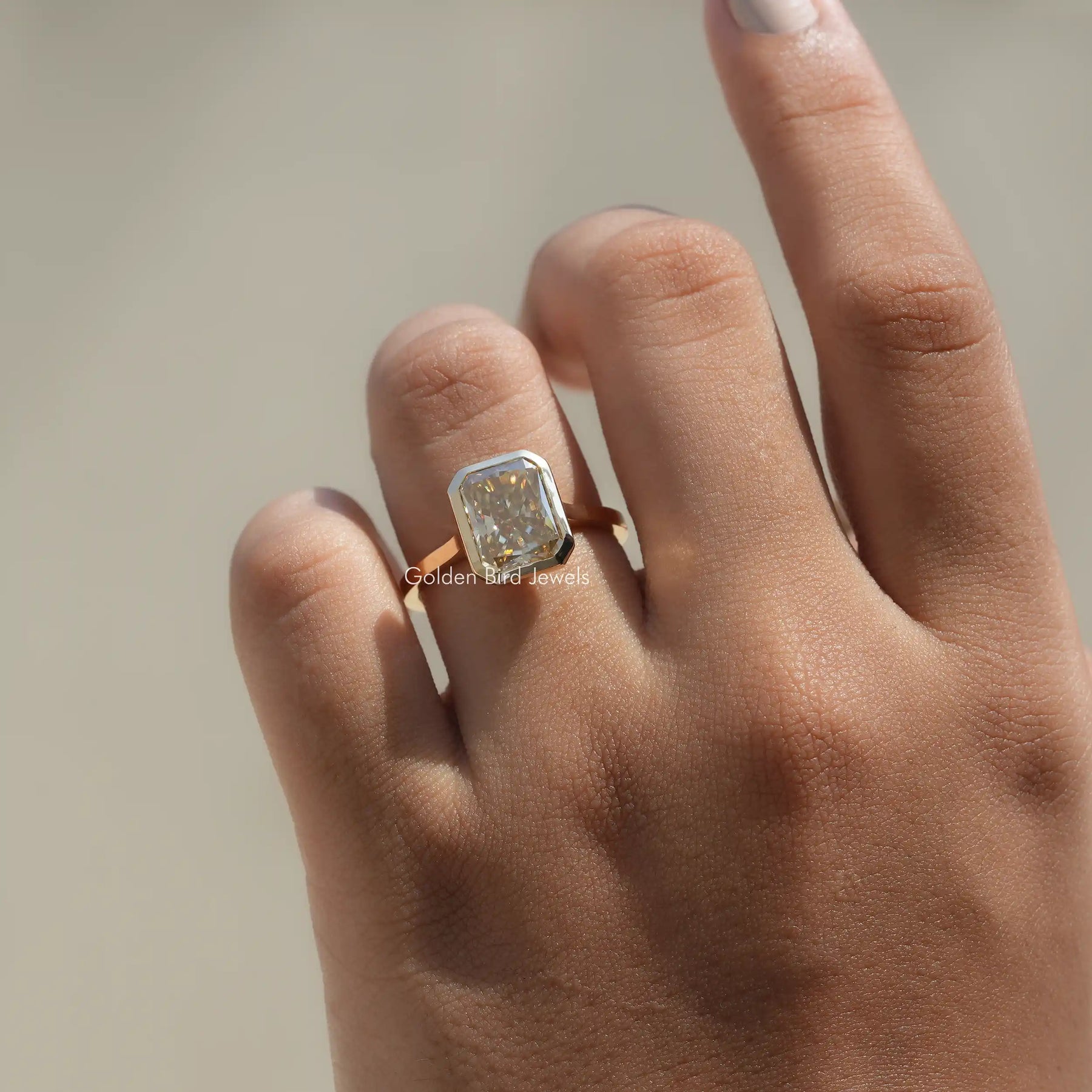 Moissanite Radiant Cut Solitaire Ring In Bezel Set In Finger