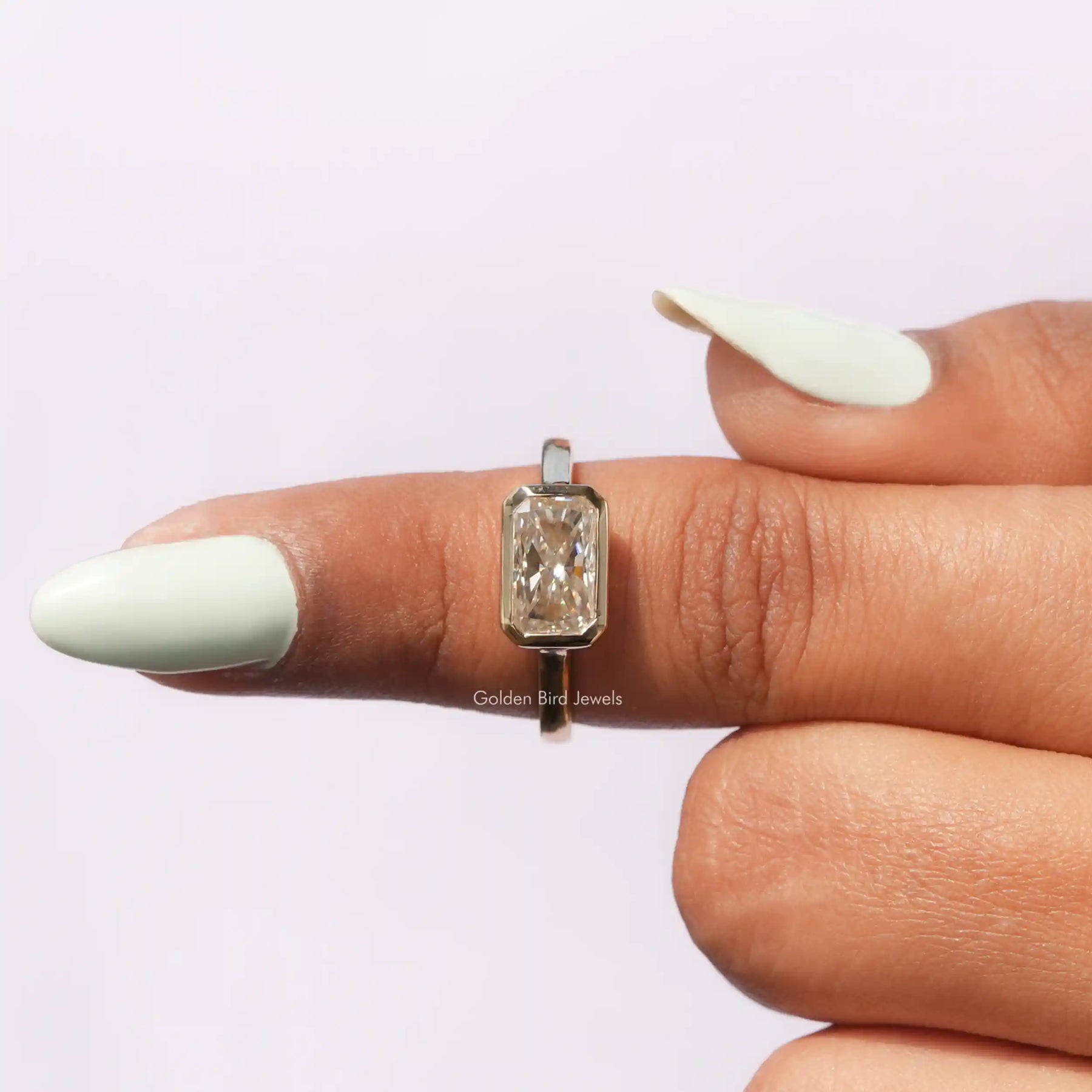 In finger front View of Radiant Cut Solitaire Engagement Ring