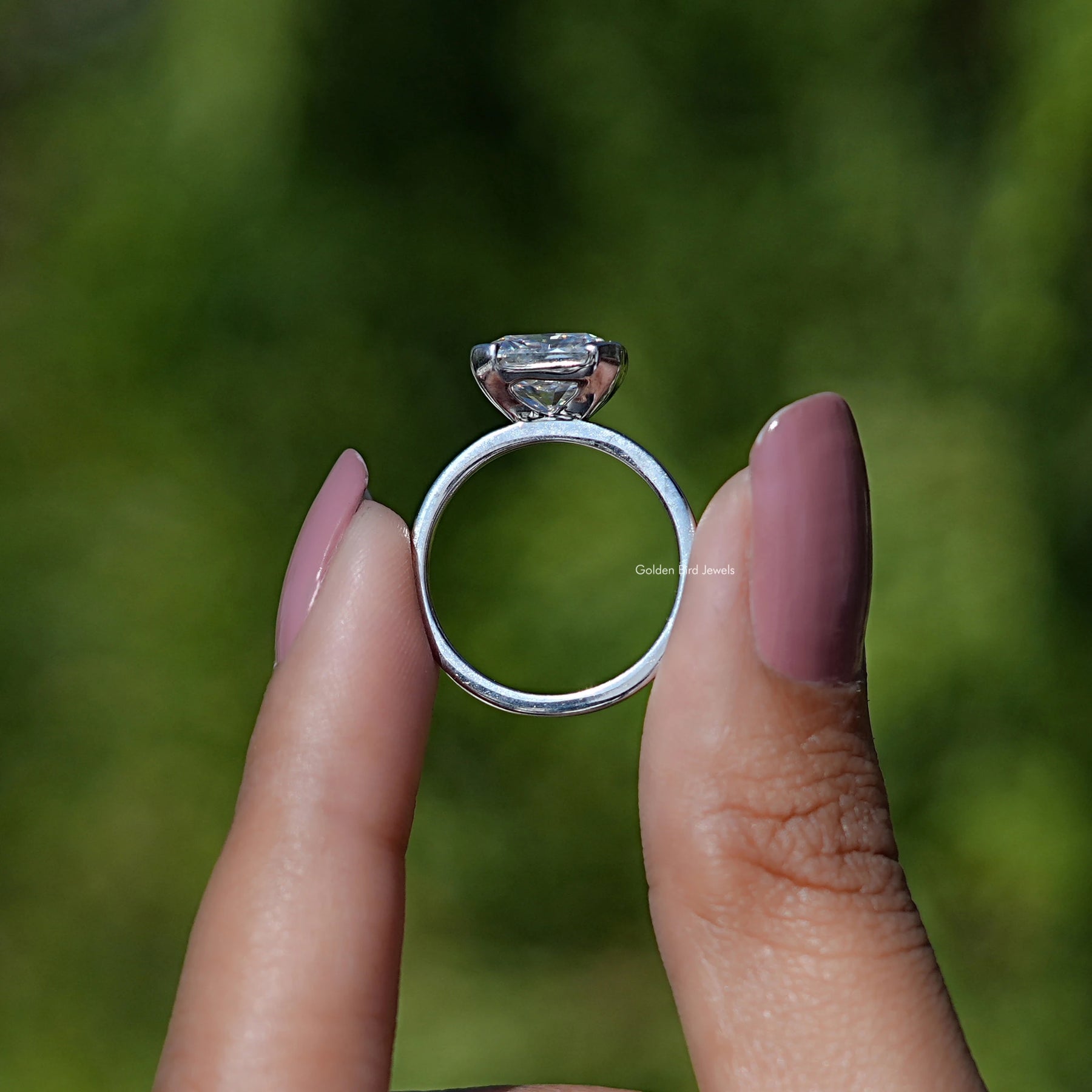 Back view of Radiant Cut Moissanite Solitaire Ring in secure setting