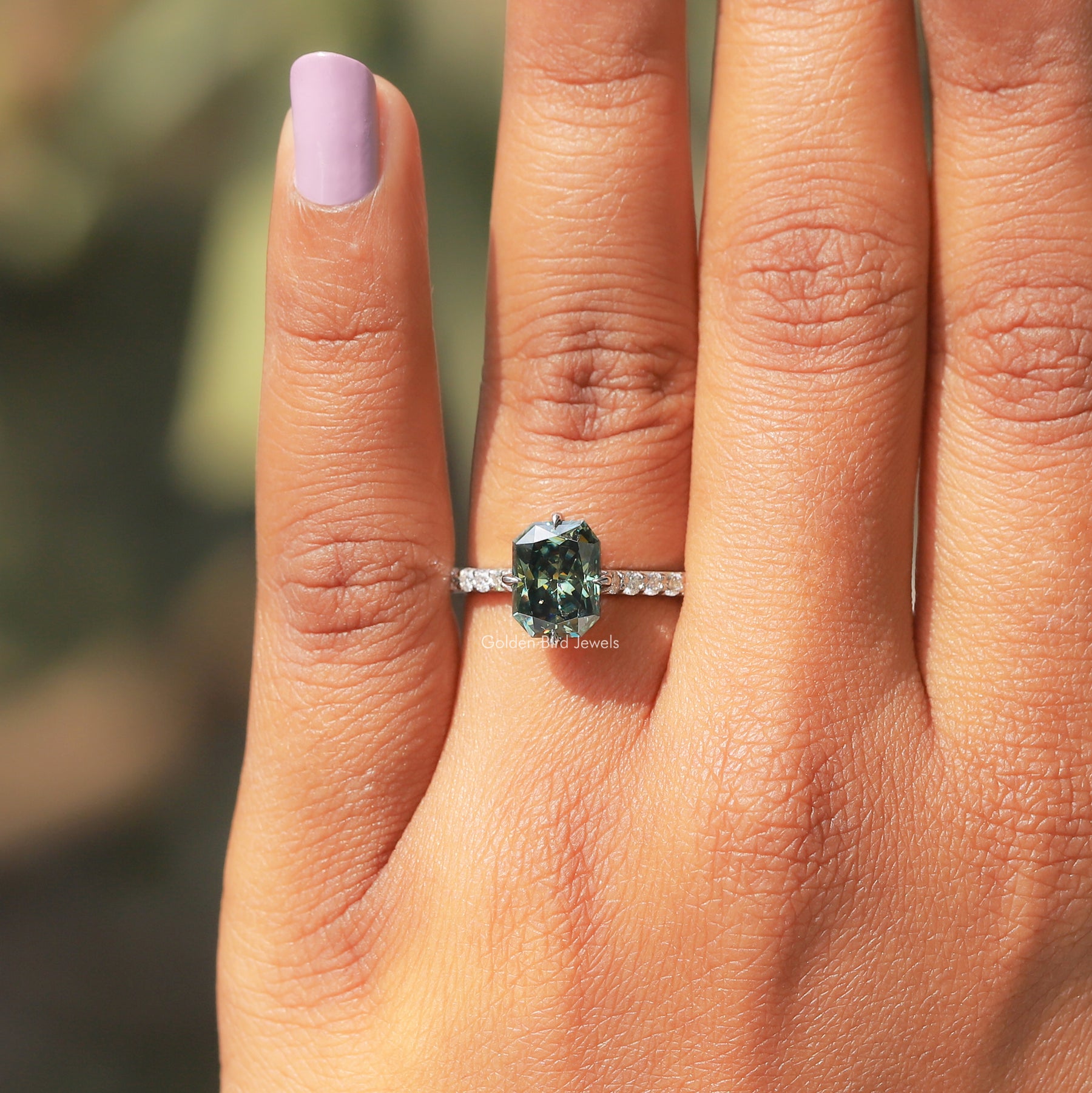 View of Radiant Cut Moissanite And Round Cut Side Stones In White Gold