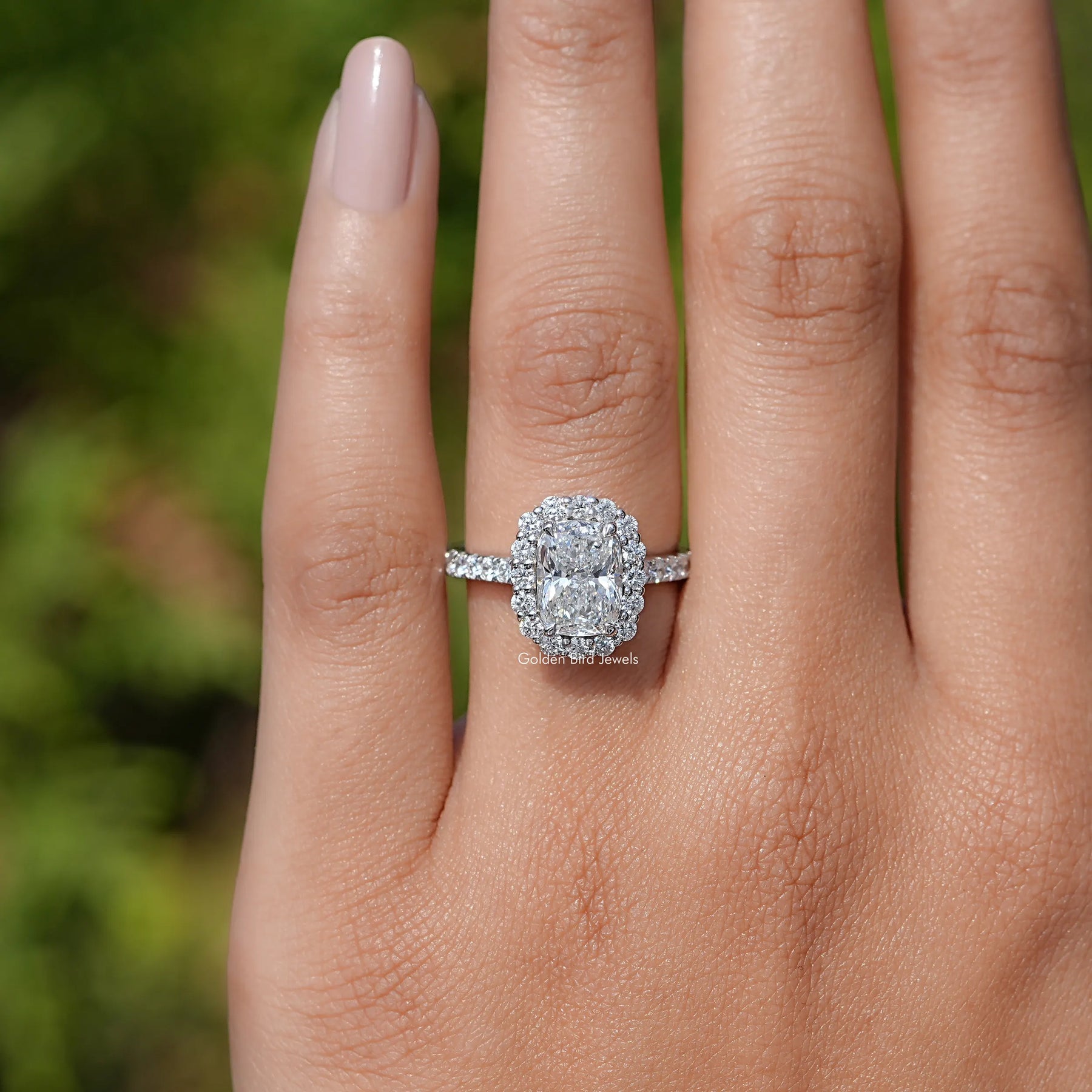 In finger front view of Radiant Lab Diamond Halo Accent Engagement Ring