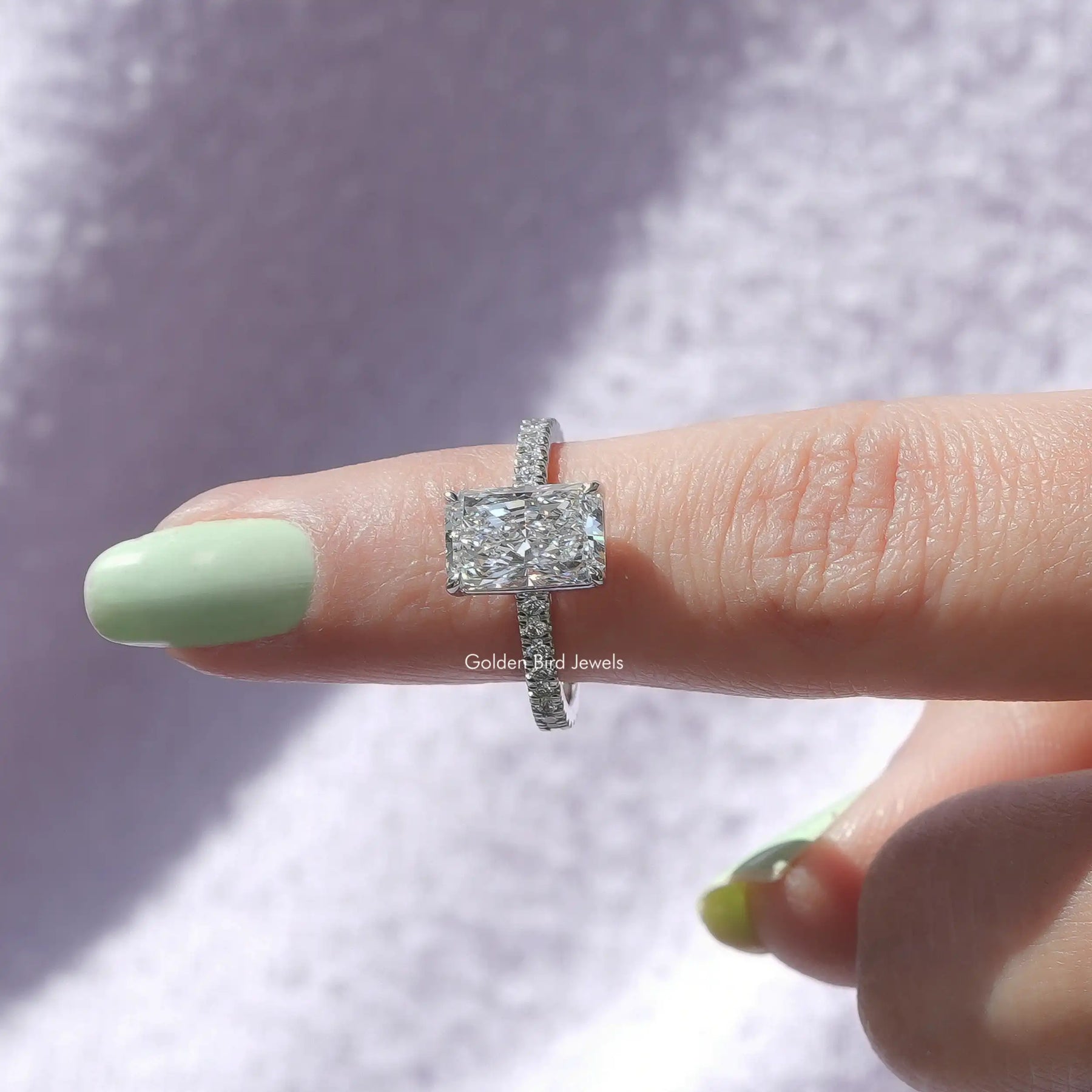 In finger front View of Radiant Cut Diamond Solitaire Ring