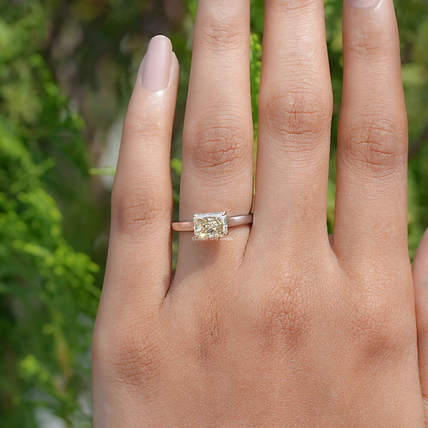 View of East West Yellow Radiant moissanite Solitaire Ring