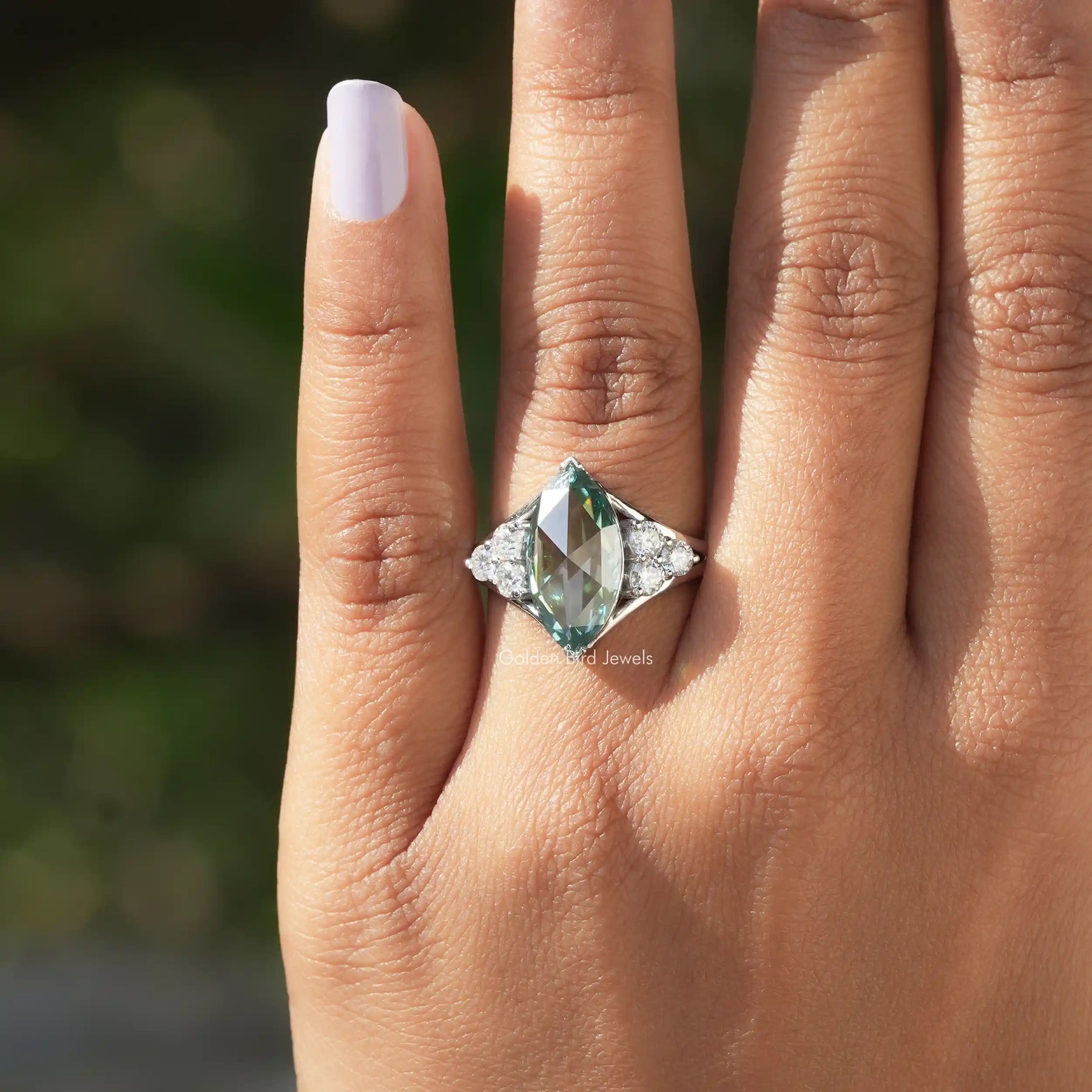 Close-Up View of Rose Cut Marquise Moissanite Engagement Ring In a finger
