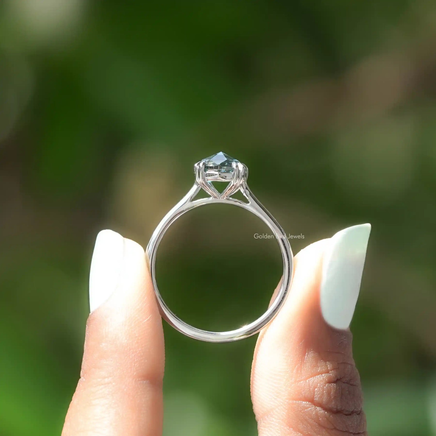 Back View of Rose Cut Oval Moissanite Engagement Ring In two fingers