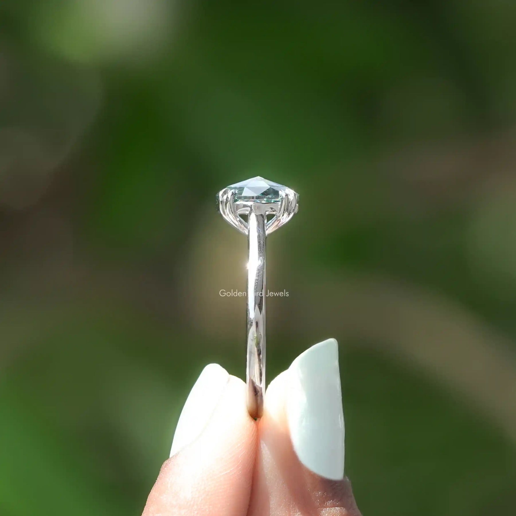 Side View of Oval Moissanite Solitaire Engagement Ring In finger