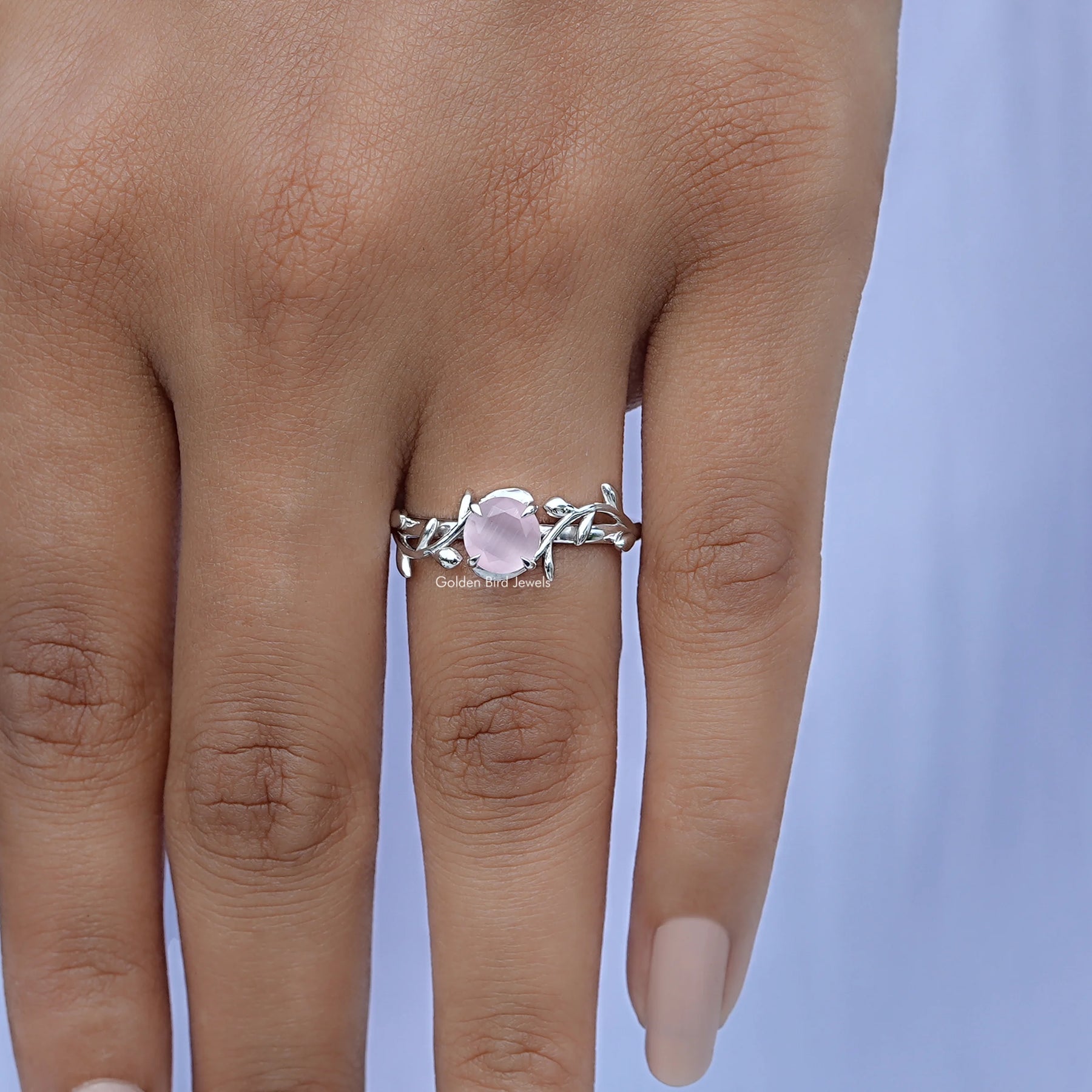 Close-Up View of Round Cut Gemstone Leaf Style Ring In White Gold
