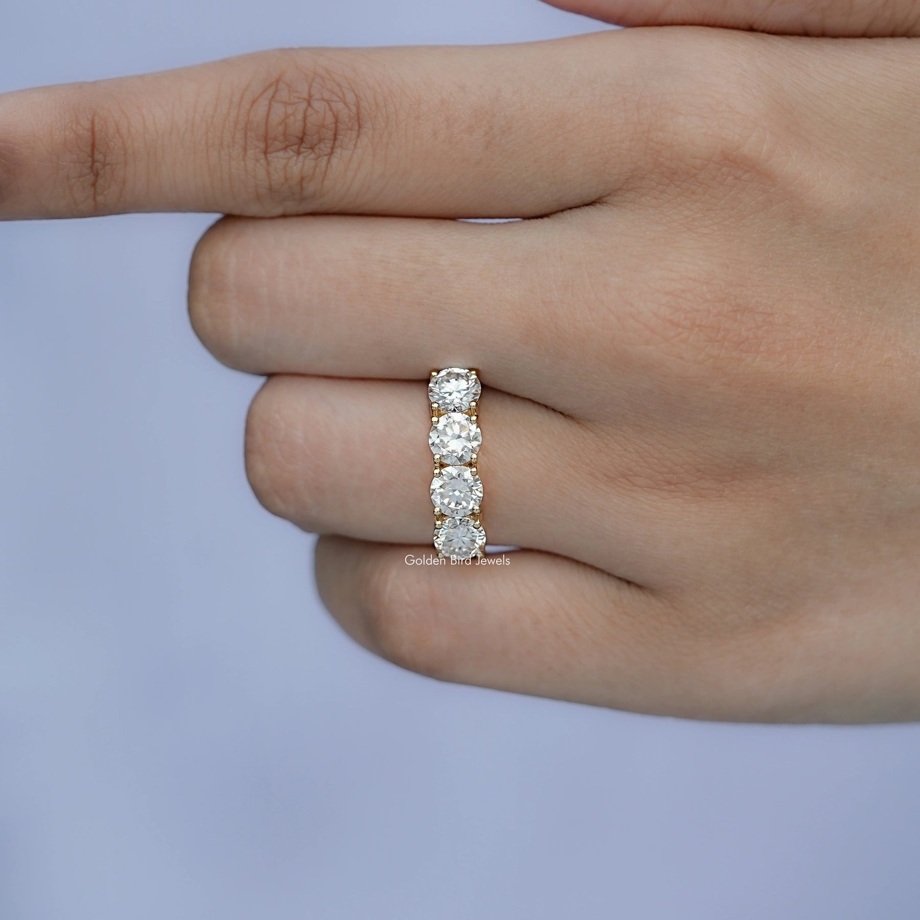 View of Pear Cut Moissanite Round Cut Eternity Wedding Band