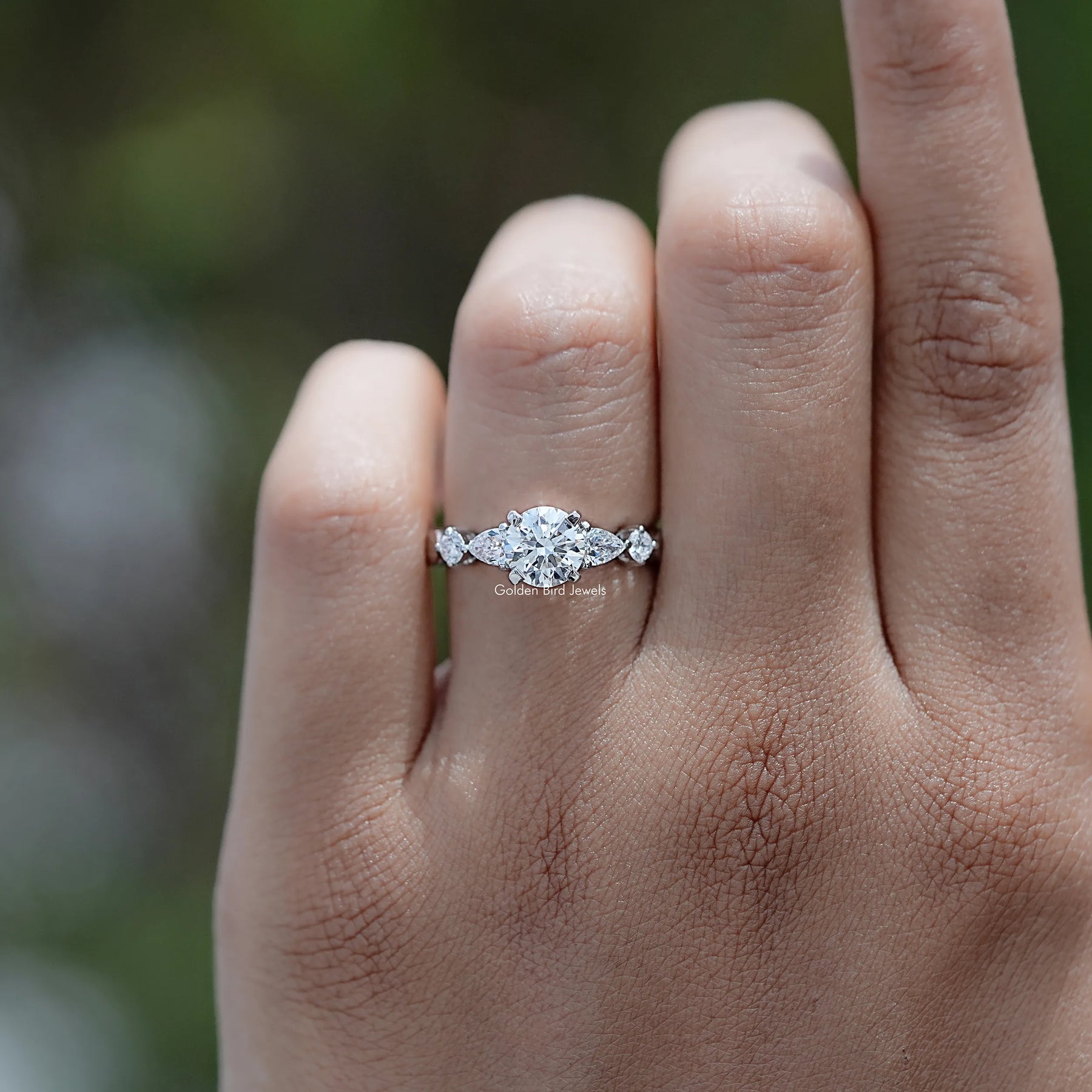 Front view of Round And Pear Cut Diamond Five Stone Ring