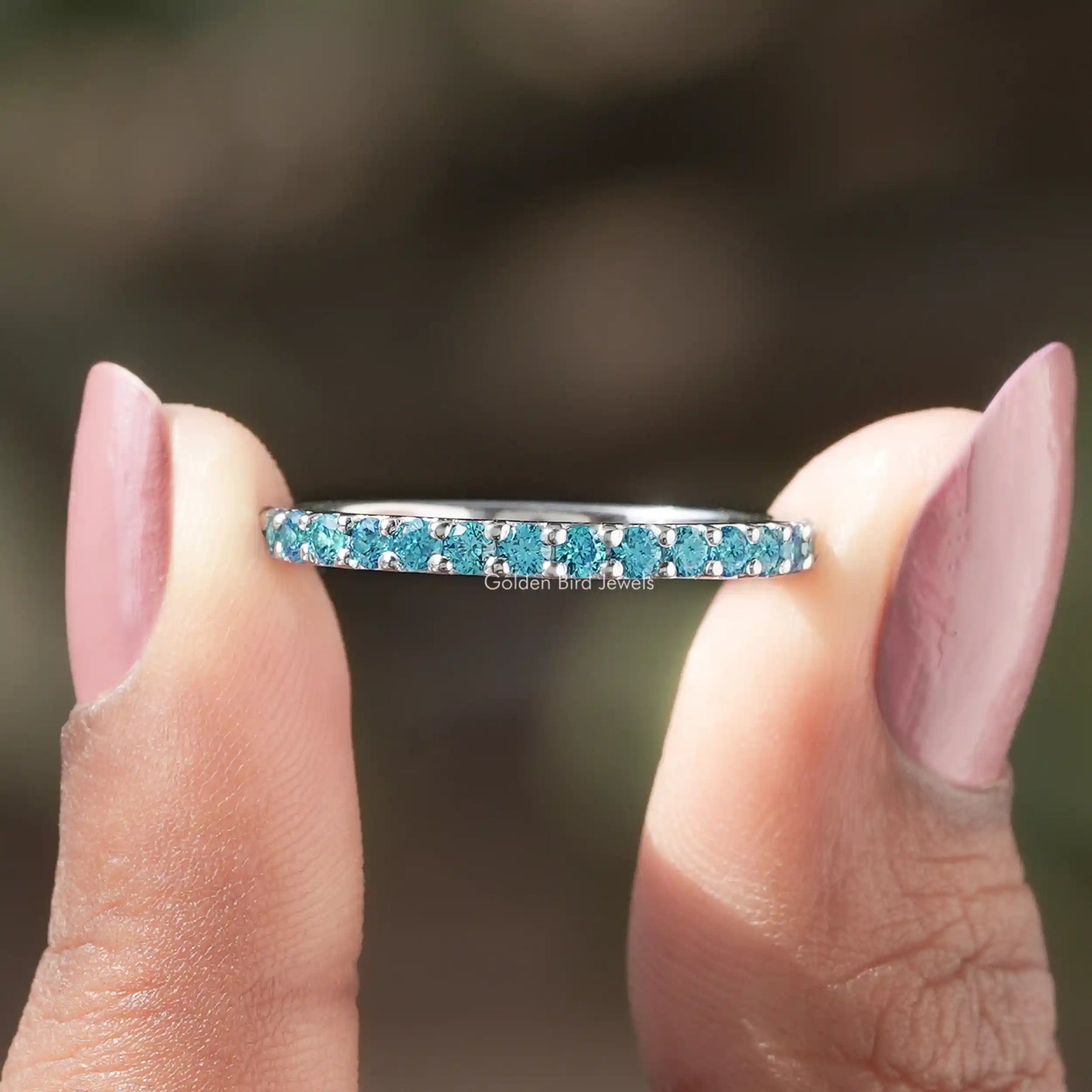 Front View of Round Cut Blue Topaz Gemstone Half Eternity Band In two Fingers