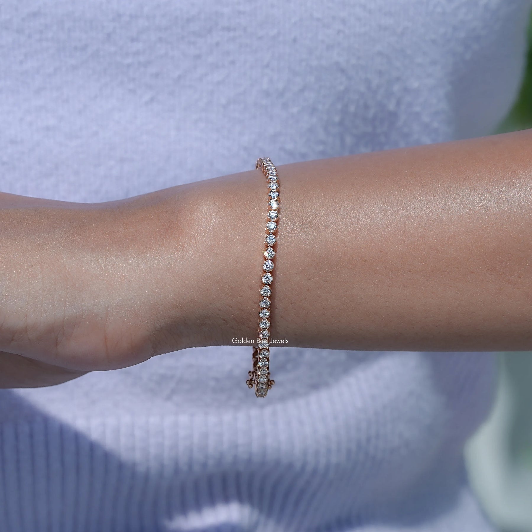 View of Round Cut Diamond Tennis Bracelet In Hand