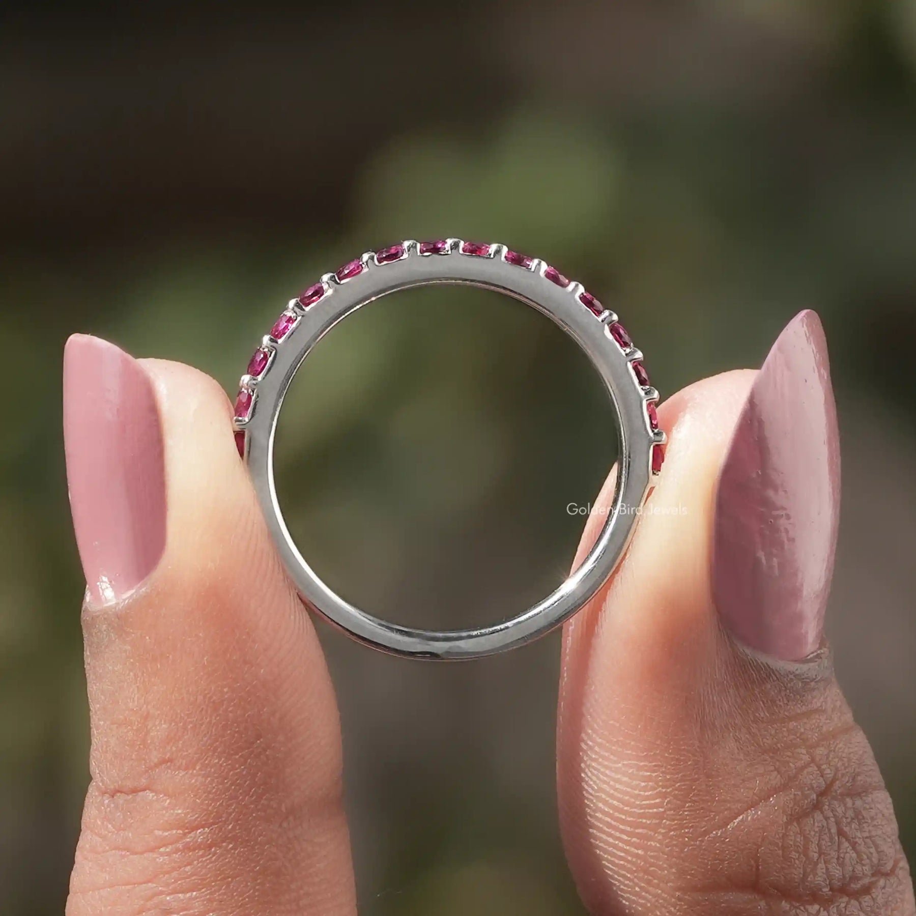 Back view of Round Cut Moissanite Solitaire Ring in secure setting