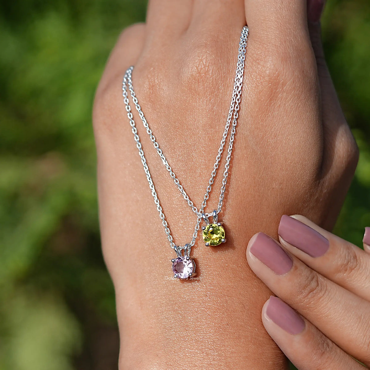 Two Round Cut Gemstone Pendant Necklace on Hand