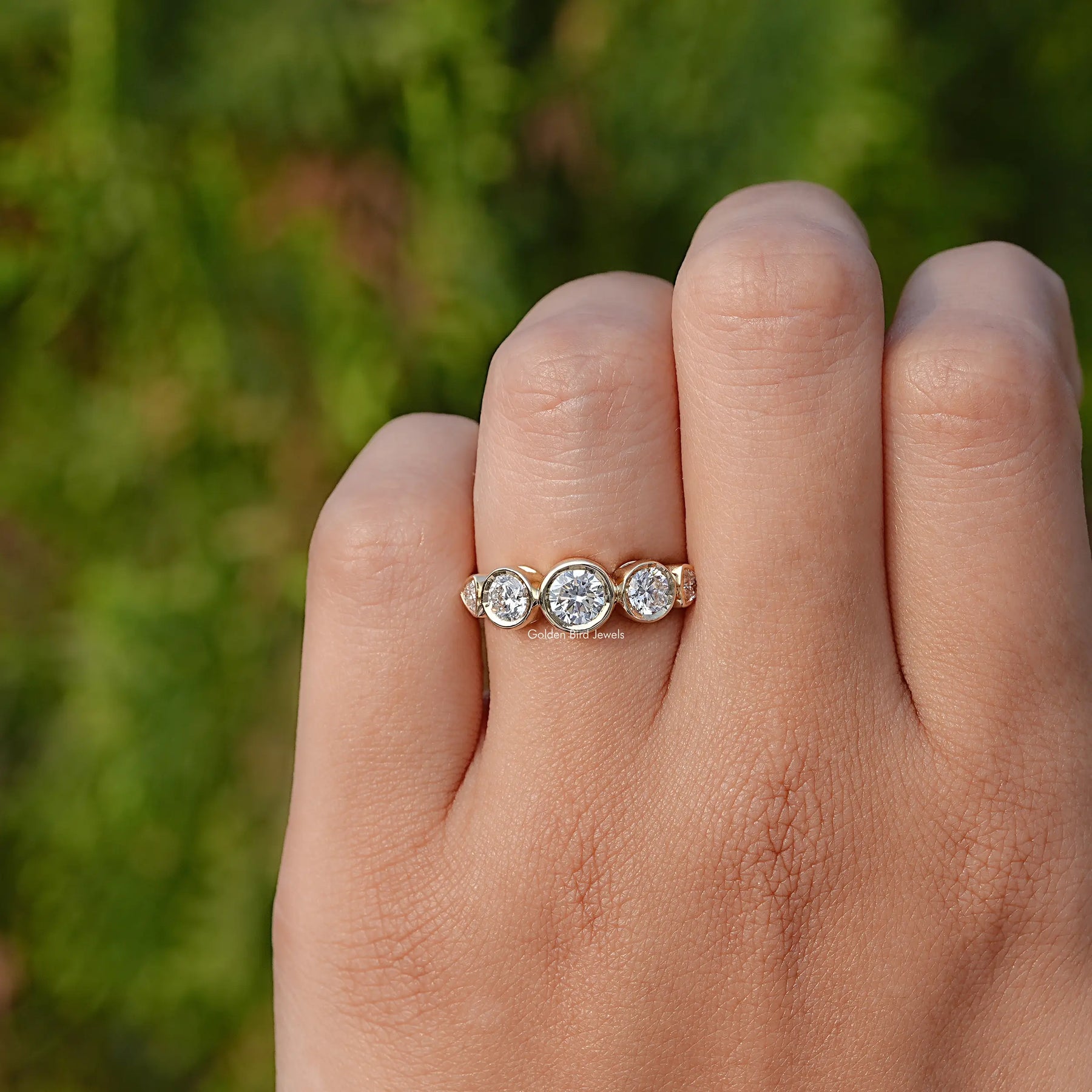 Detailed View of Round Cut Five Stone Bezel Set Ring In Yellow Gold