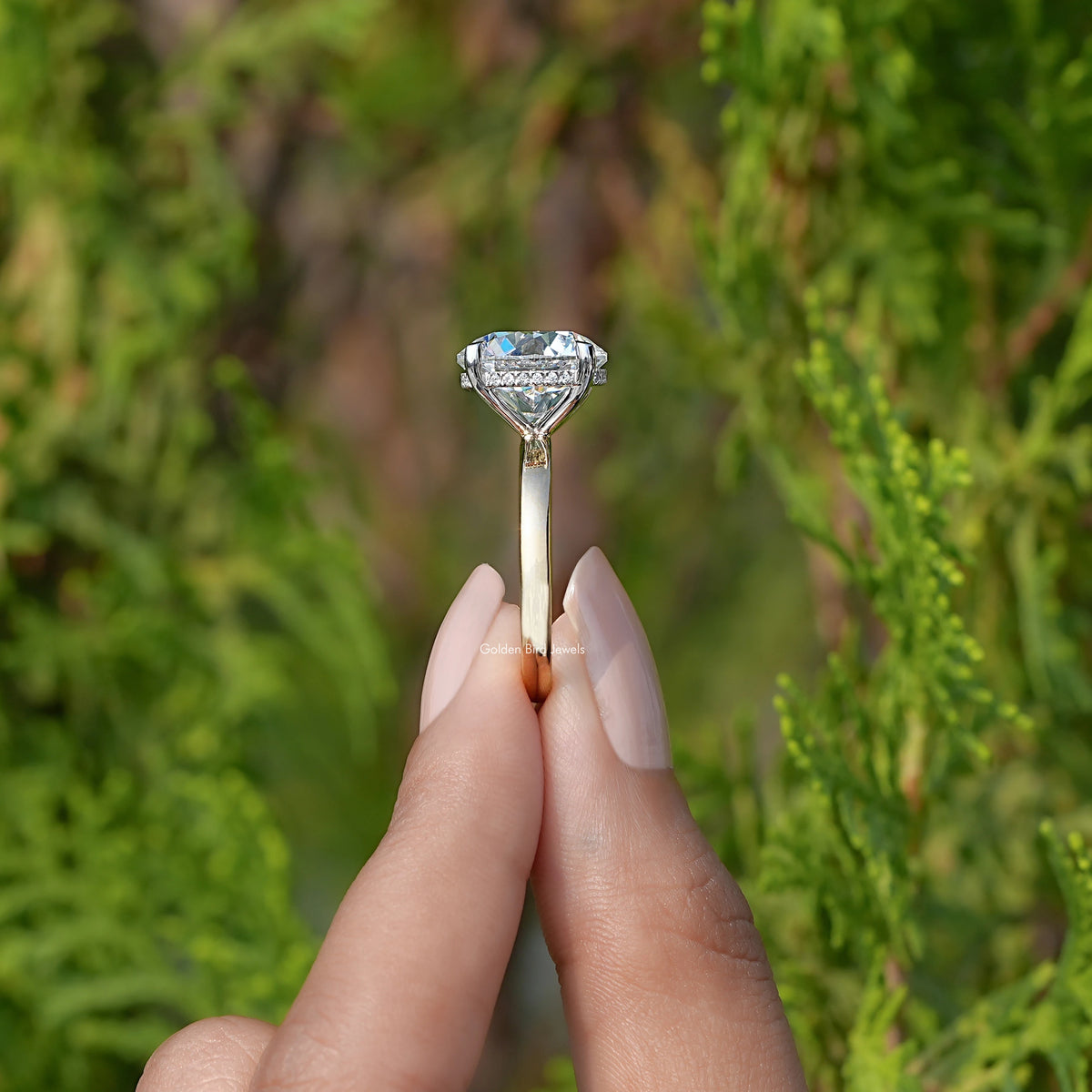 Side View of Round Cut Lab Diamond Solitaire Engagement Ring In two fingers