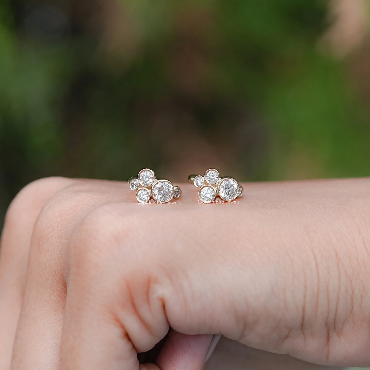 In Hand Showing View Of Round lab diamond Earrings