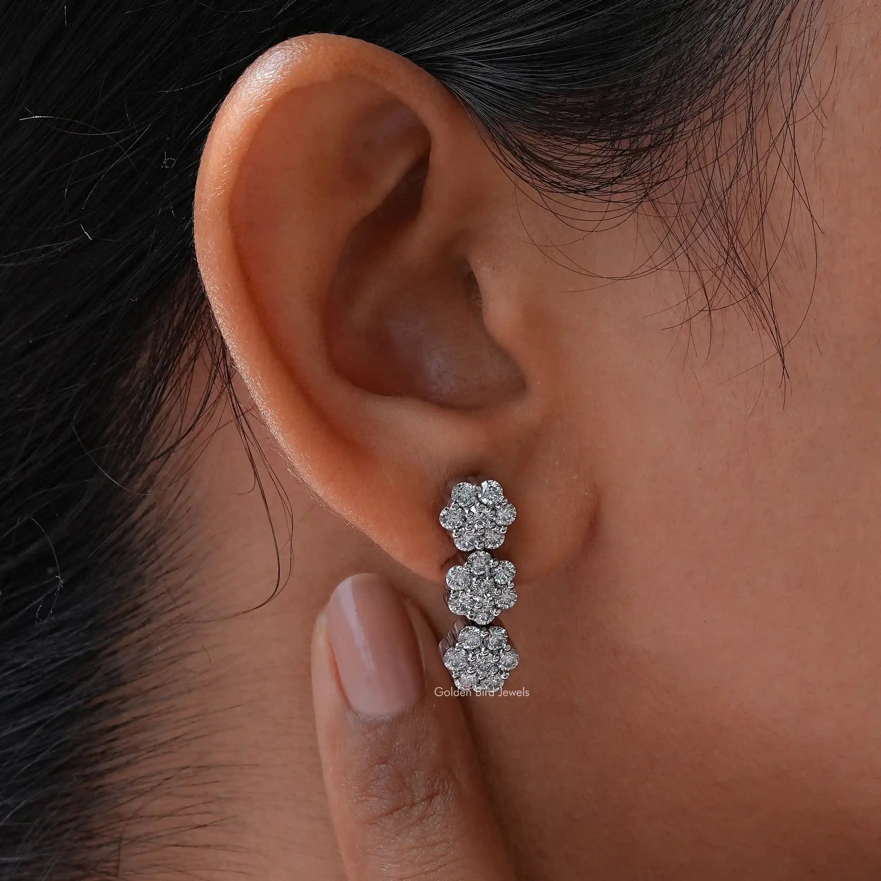 Flower Style Round Cut Moissanite Earrings in ear
