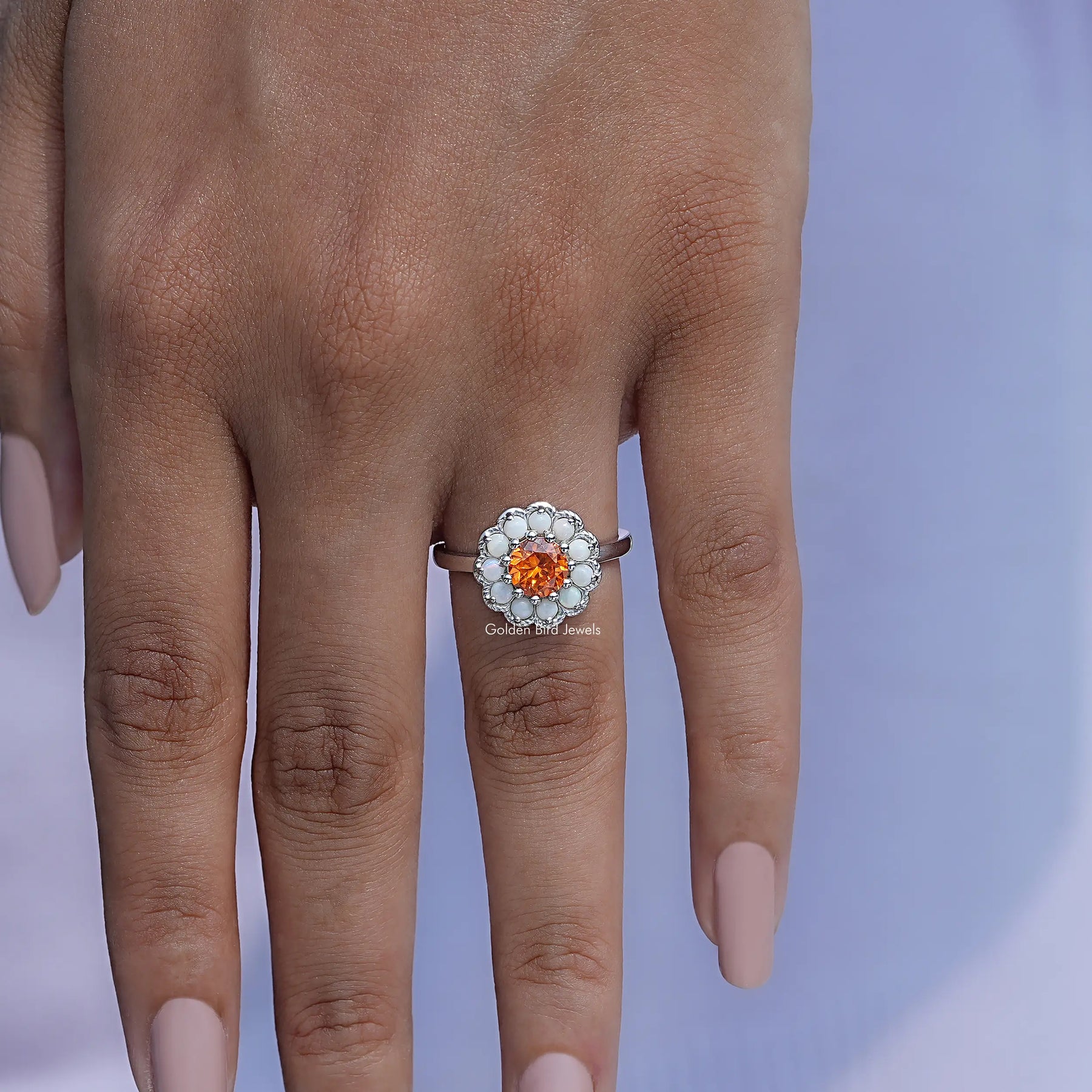 Detailed View Of Round Cut Sunstone Halo Ring