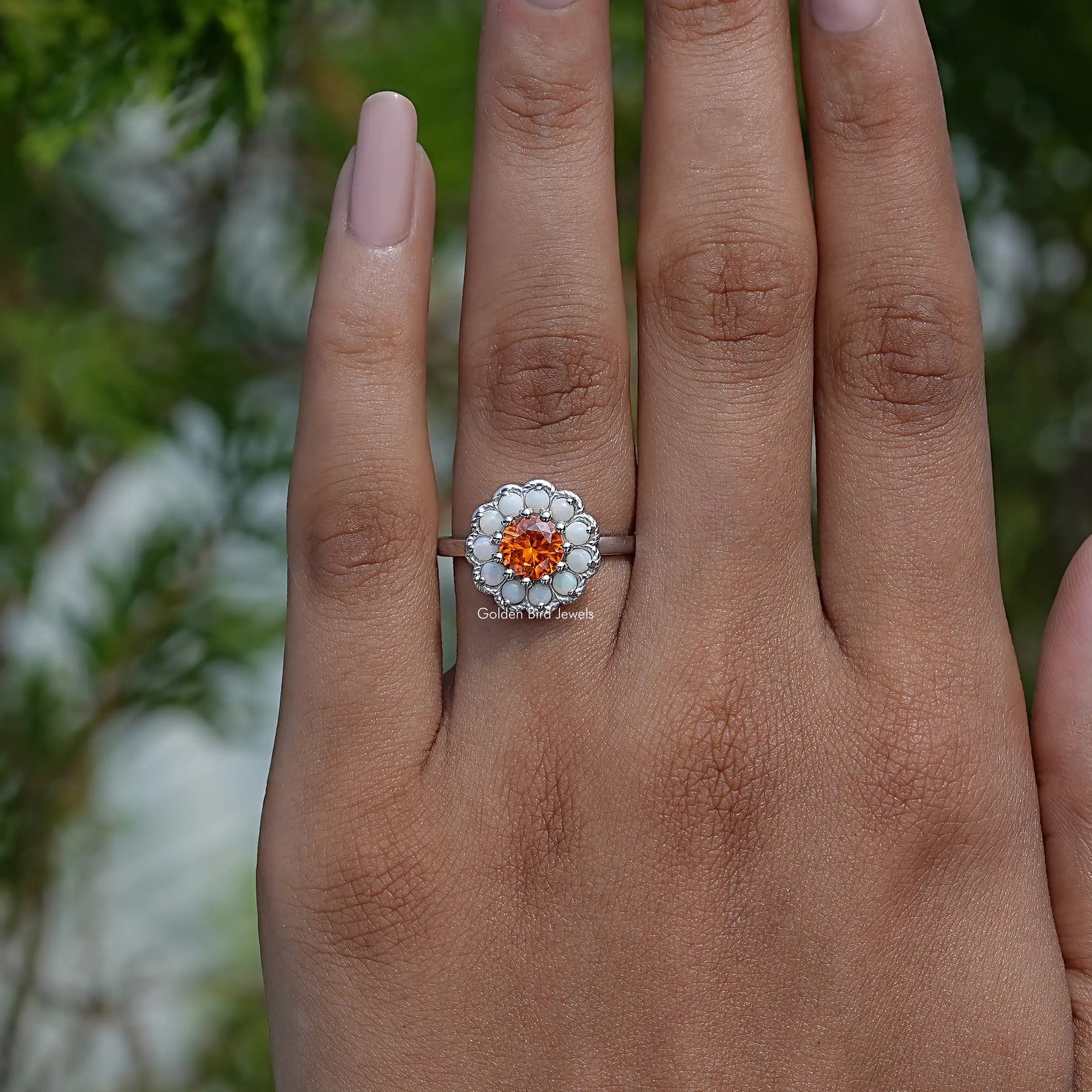 Front View of Round Cut Ring With White Opal Side Stones In White Gold