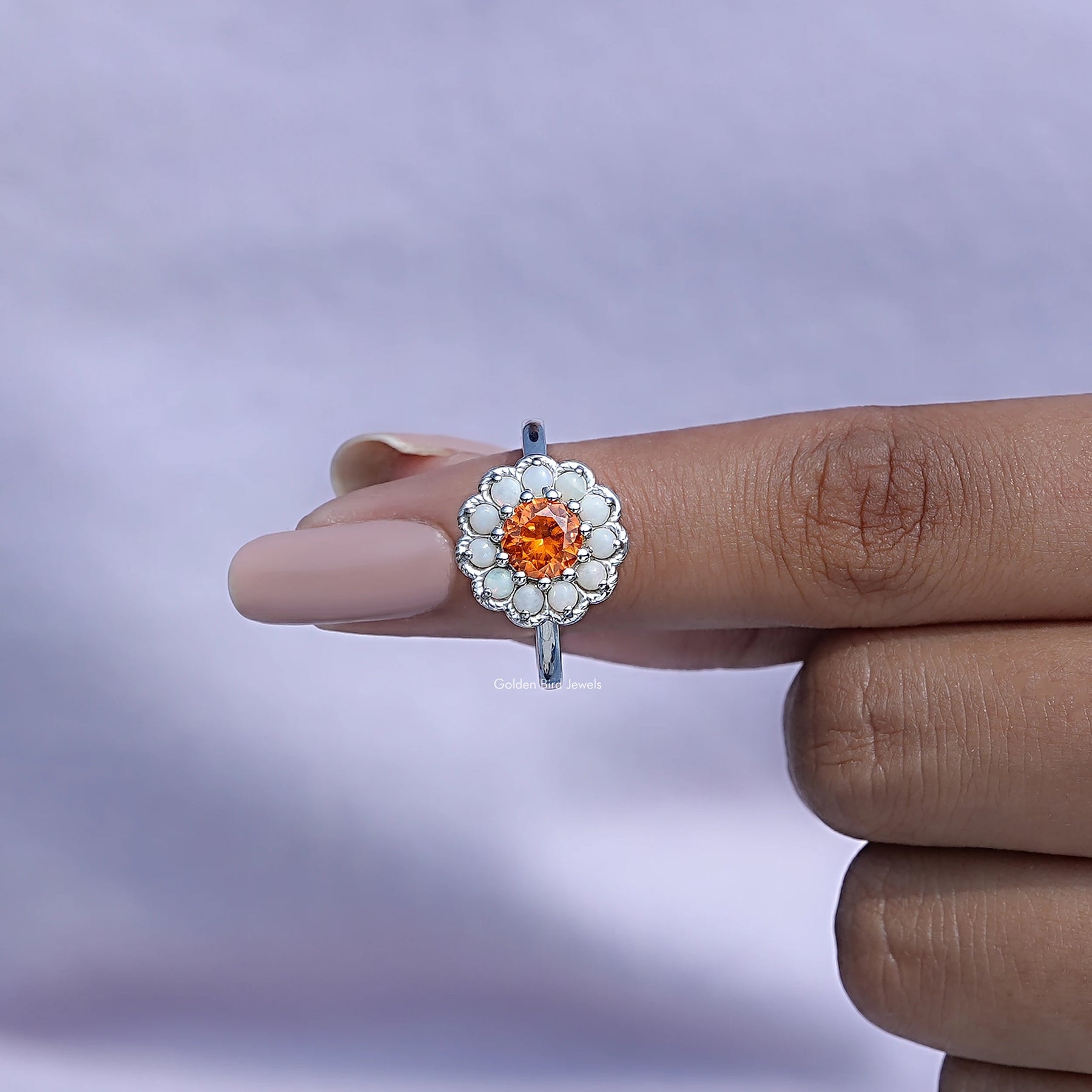 In finger front View of Round Cut Sunstone Engagement Ring In White Gold